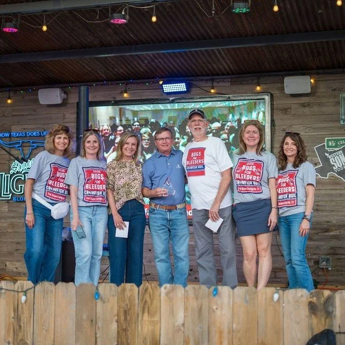 The Martin family being recognized on stage with Lone Star volunteers