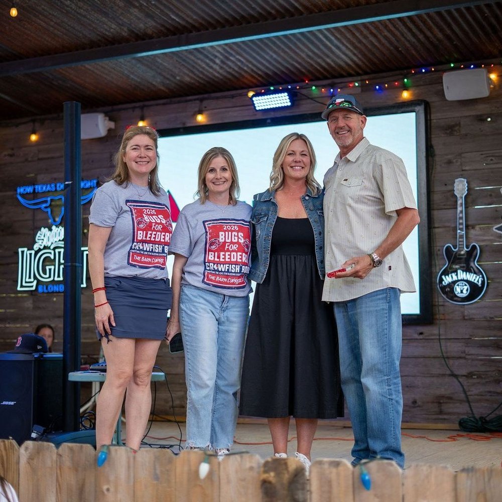 The Clawson family being recognized on stage with Lone Star volunteers