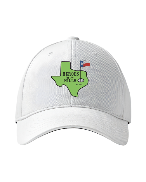White cap with the green Texas Heroes in the Hills logo on the front