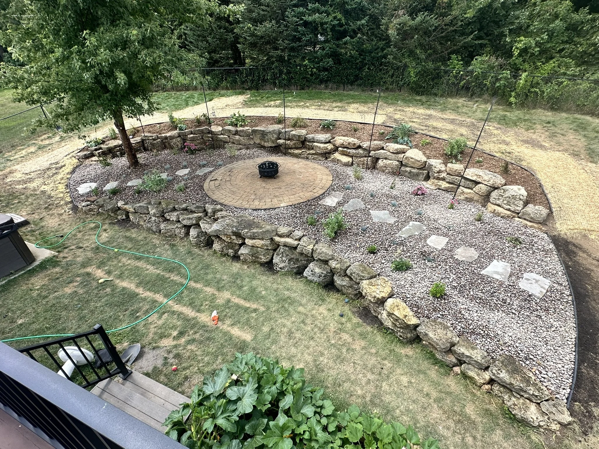 Outcropping Retaining Wall, Rock Beds &amp; Fire Pit Patio Revival — Monticello, WI