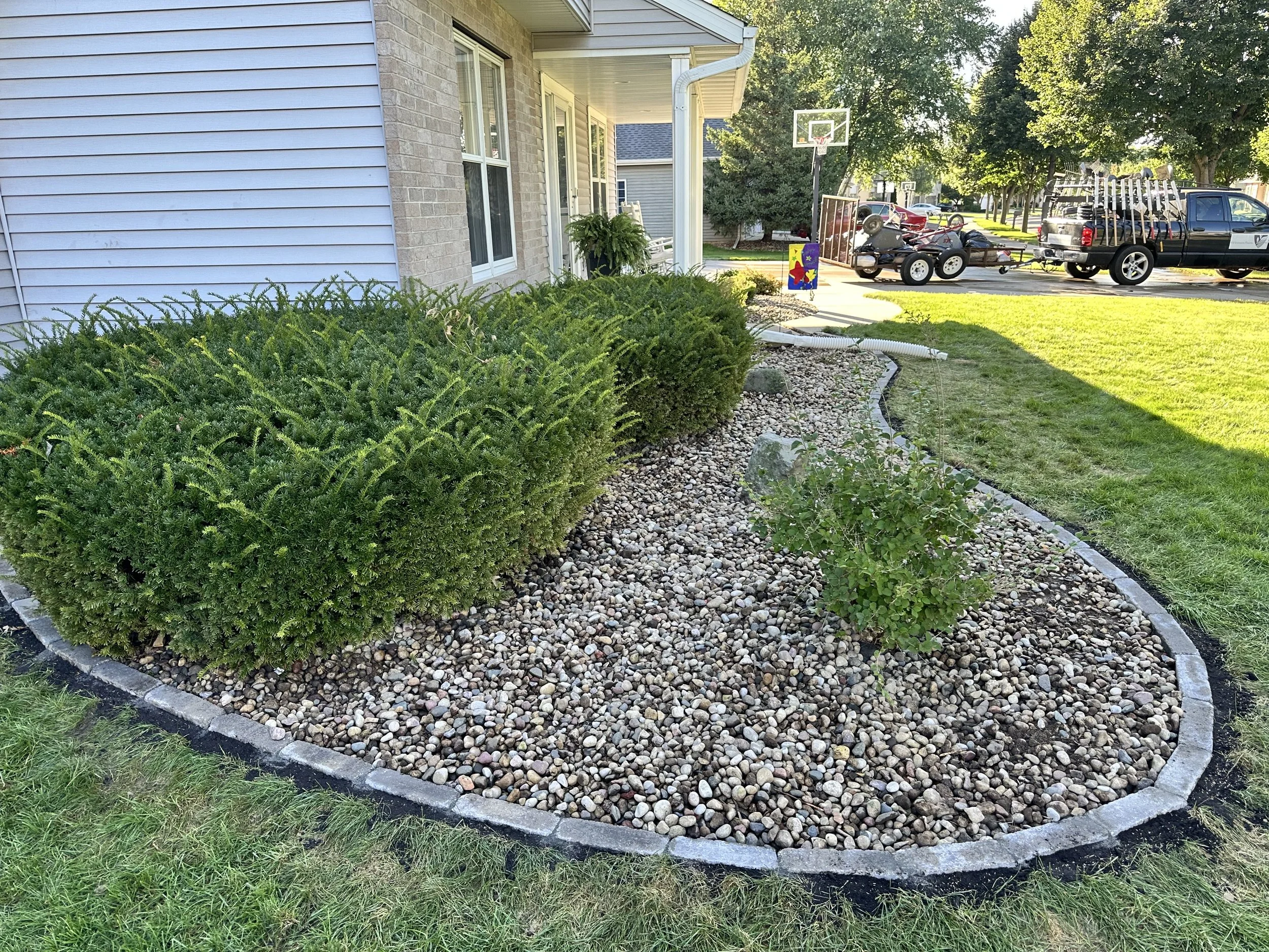 Stone Edging &amp; Decorative Rock Bed Refresh — McFarland, WI