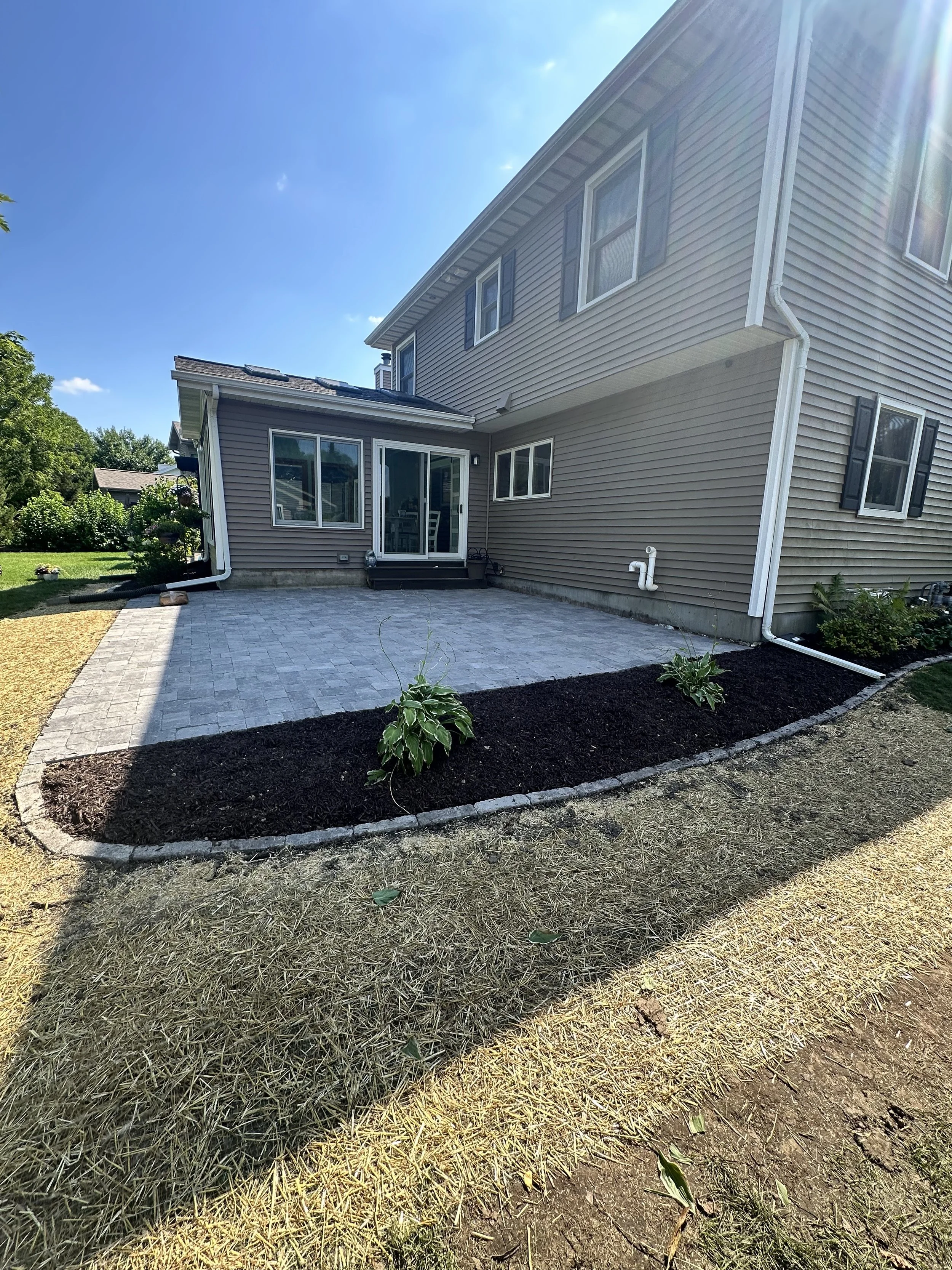 Paver patio with curved mulch bed — Middleton WI
