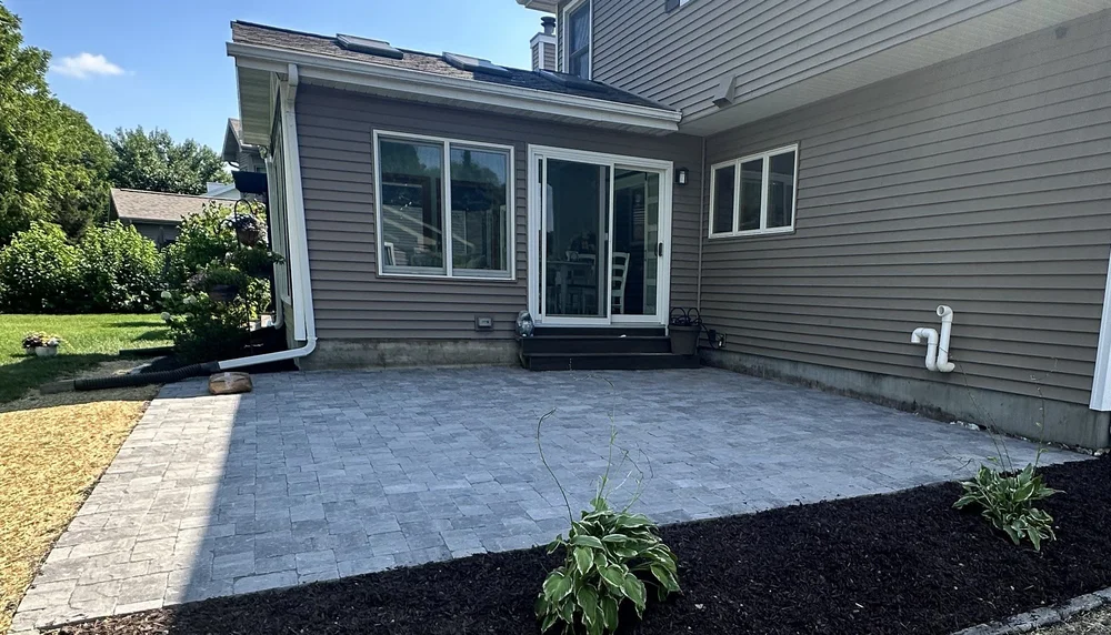 Paver patio with curved mulch bed in Middleton, WI by YD Exterior Visions