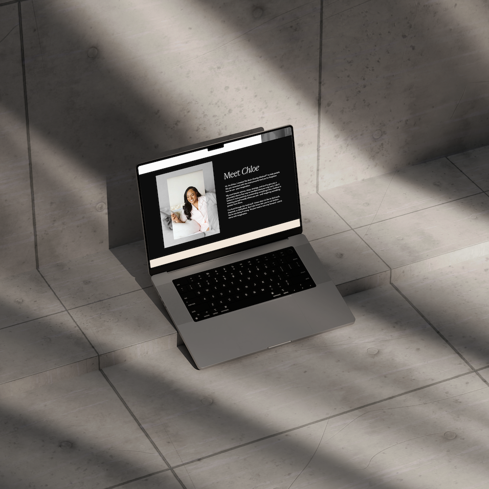 Laptop on tiled steps displaying a website for Chloe Cooper designed by Evelle Creative.