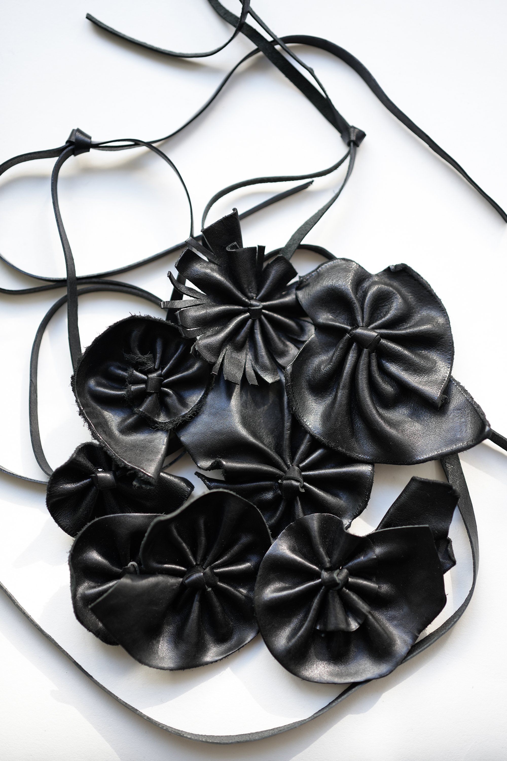 Marie-Bernadette-Woehrl-leather-flower-necklace-on-a-string-handmade-unique-piece-artisanal-antwerp-1.jpg
