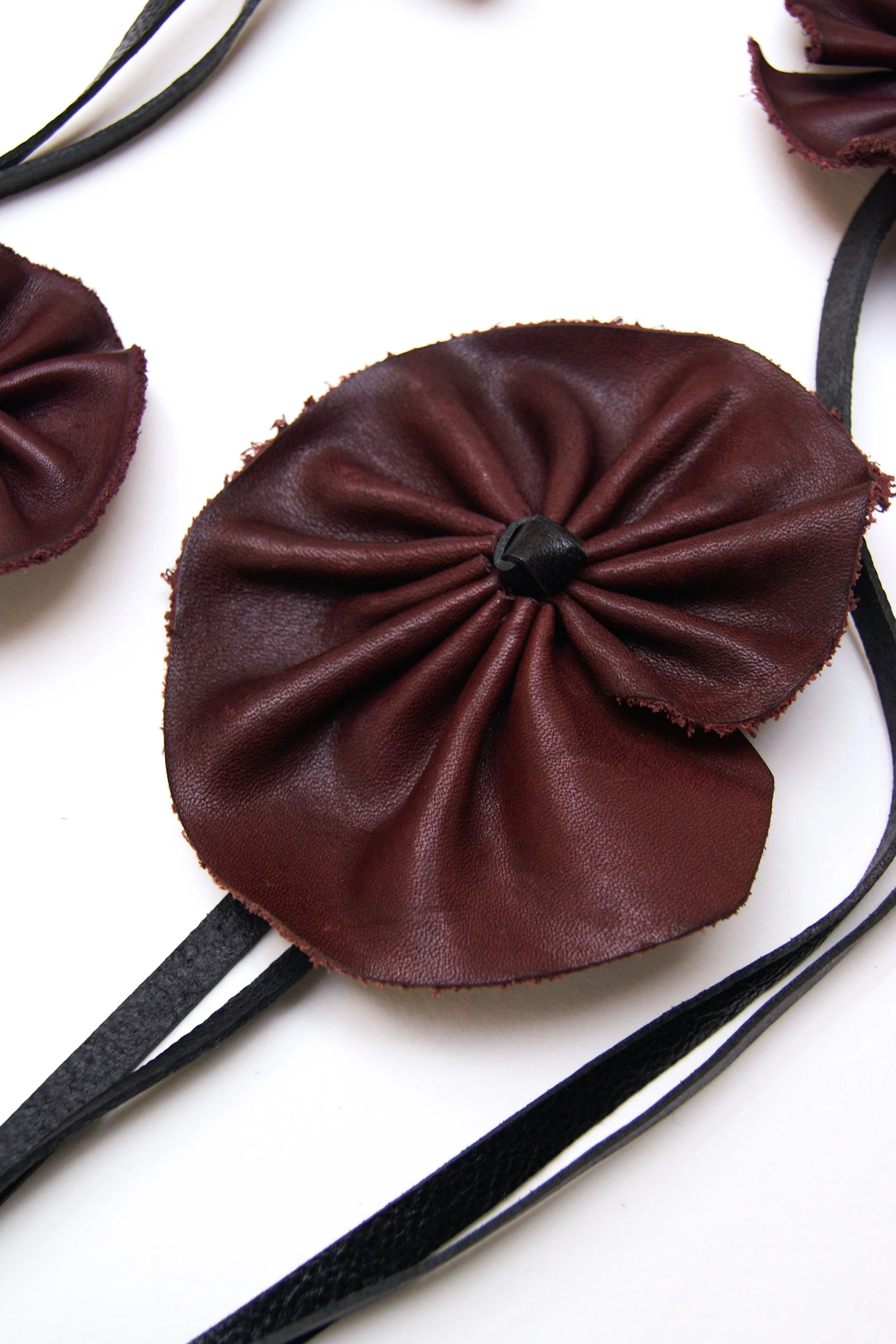 Marie-Bernadette-Woehrl-leather-flower-on-a-string-necklace-burgundy-handmade-unique-piece-artisanal-antwerp-2.jpg