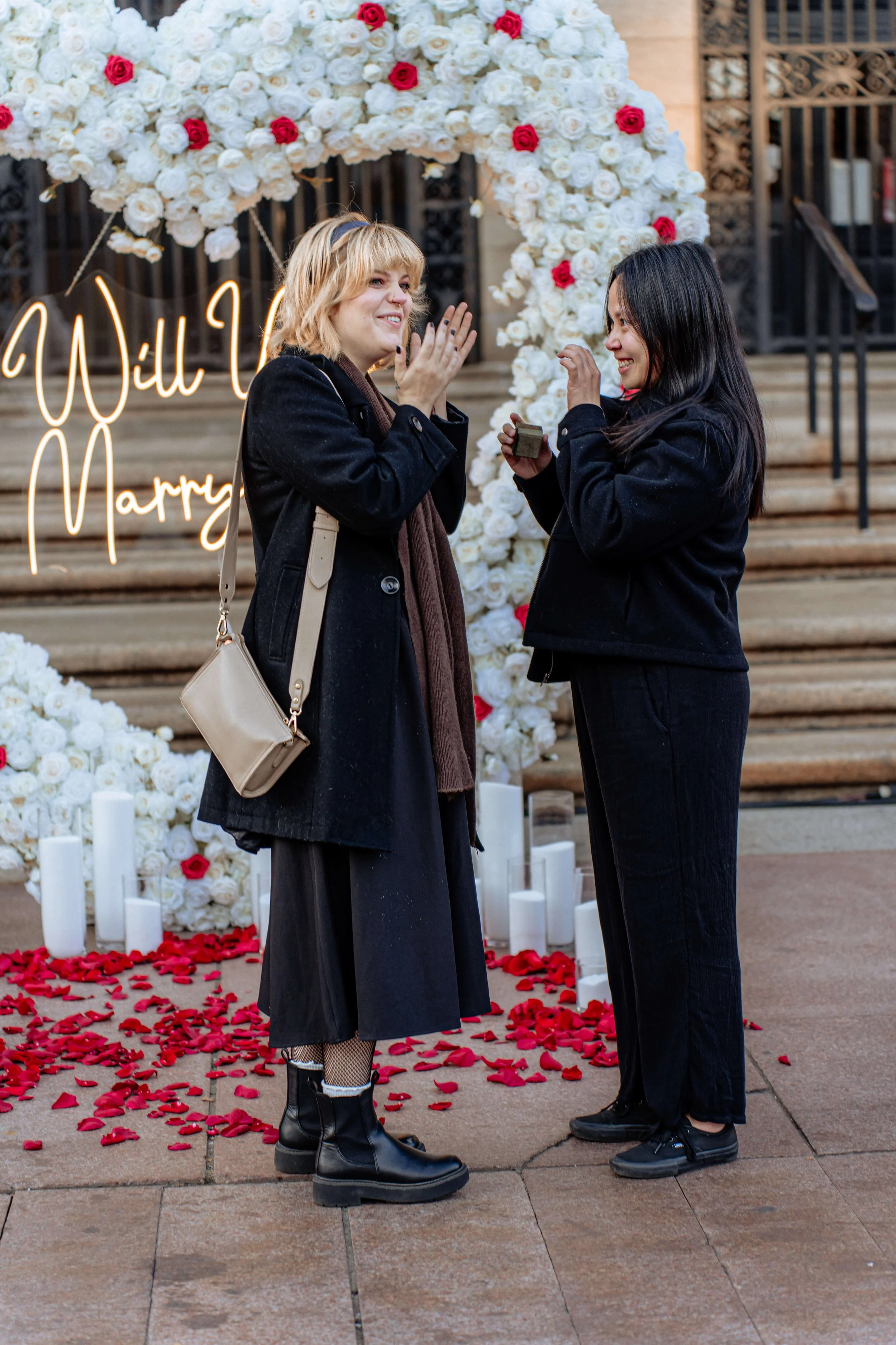 Surprise engagement proposal at Boston Public Library courtyard