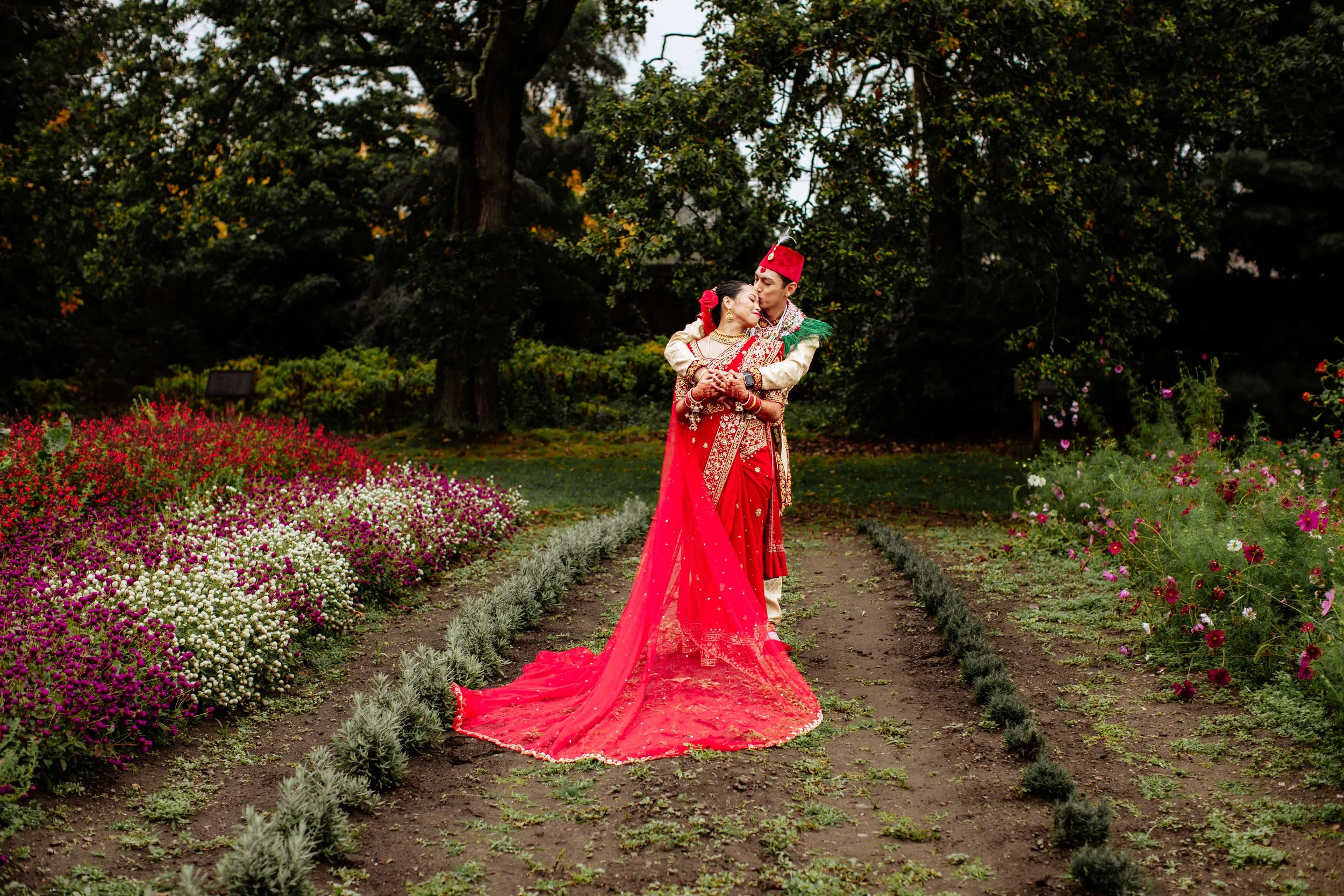 Nepali couple standing together in the rain during their Boston wedding.