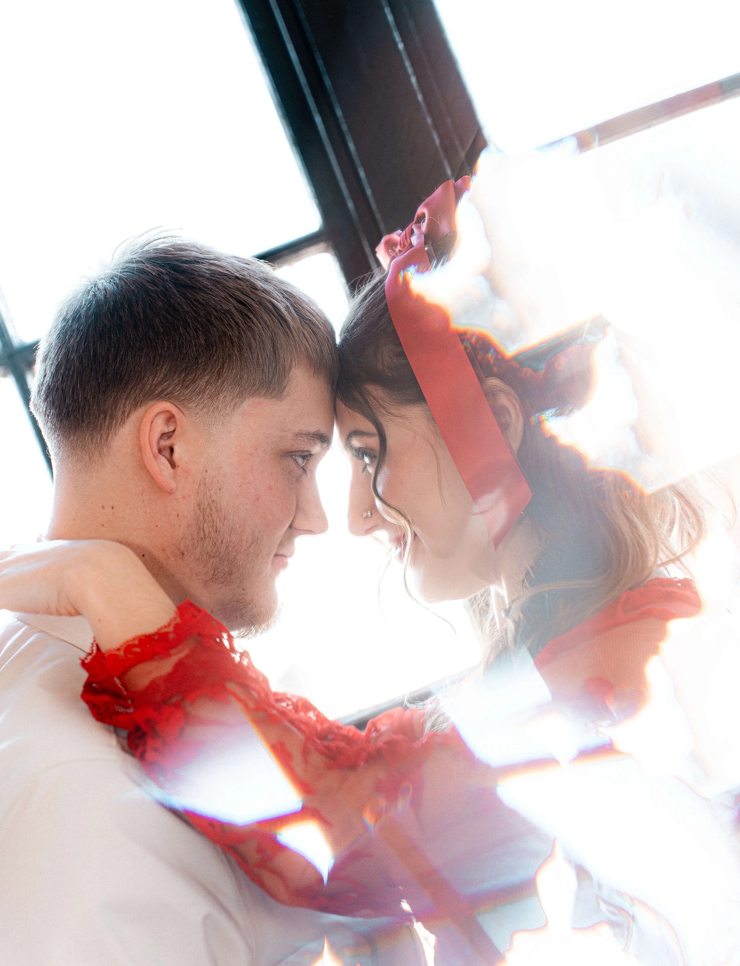 Couple looking at each other during an intimate studio couples photography session.