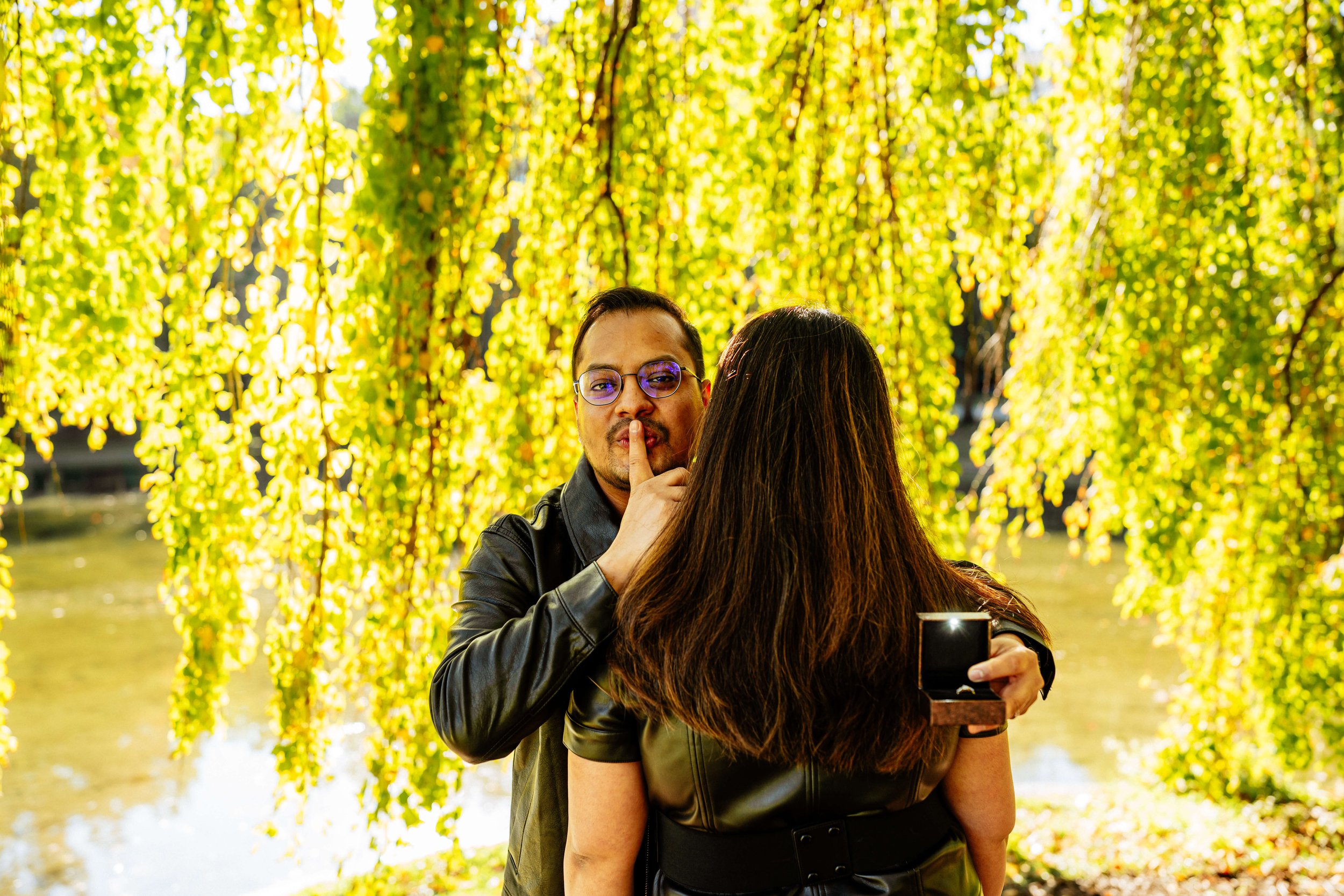 Creative surprise proposal moment at Boston Public Garden engagement session