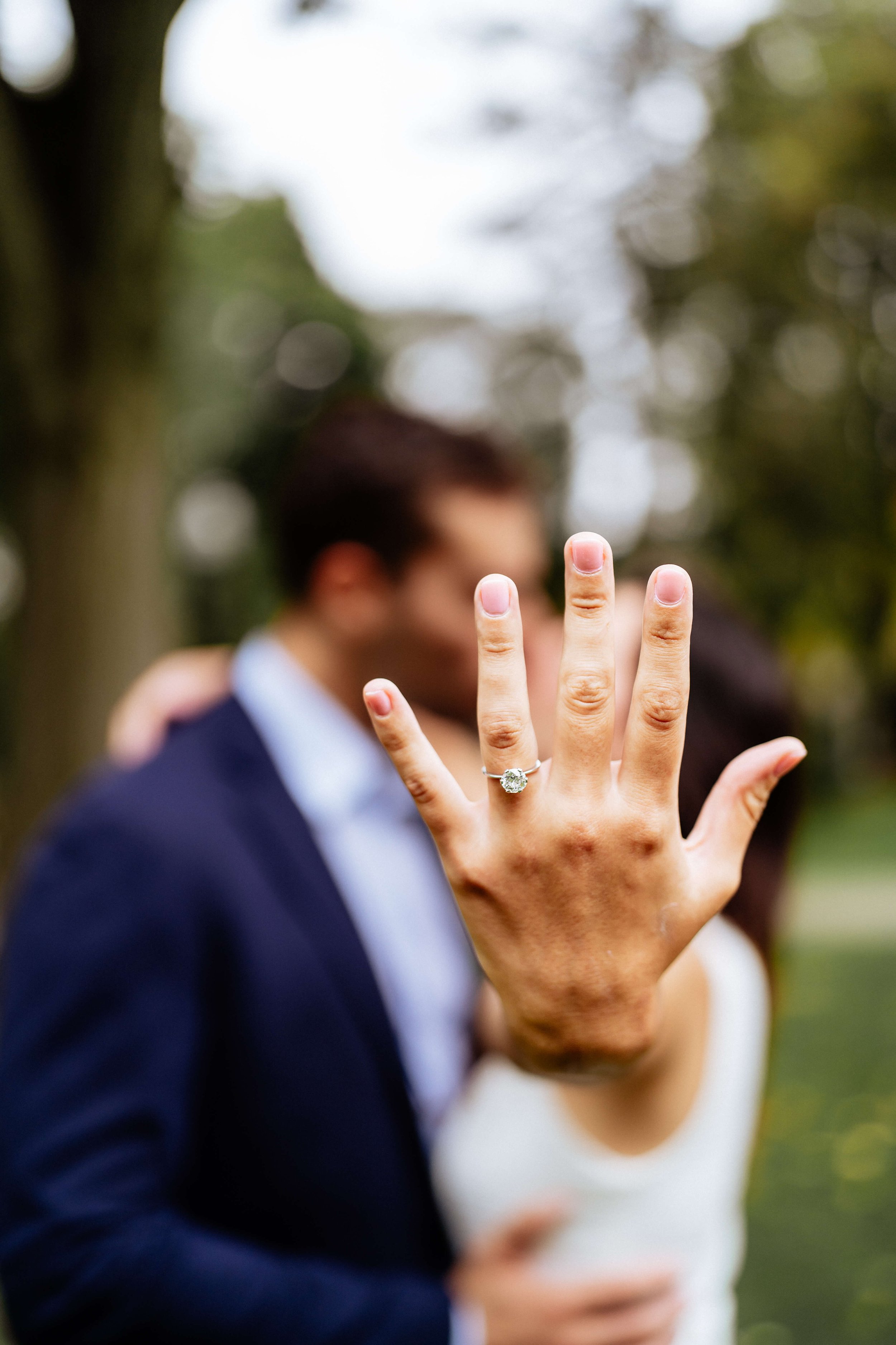 Engagement ring close up photographed during romantic proposal