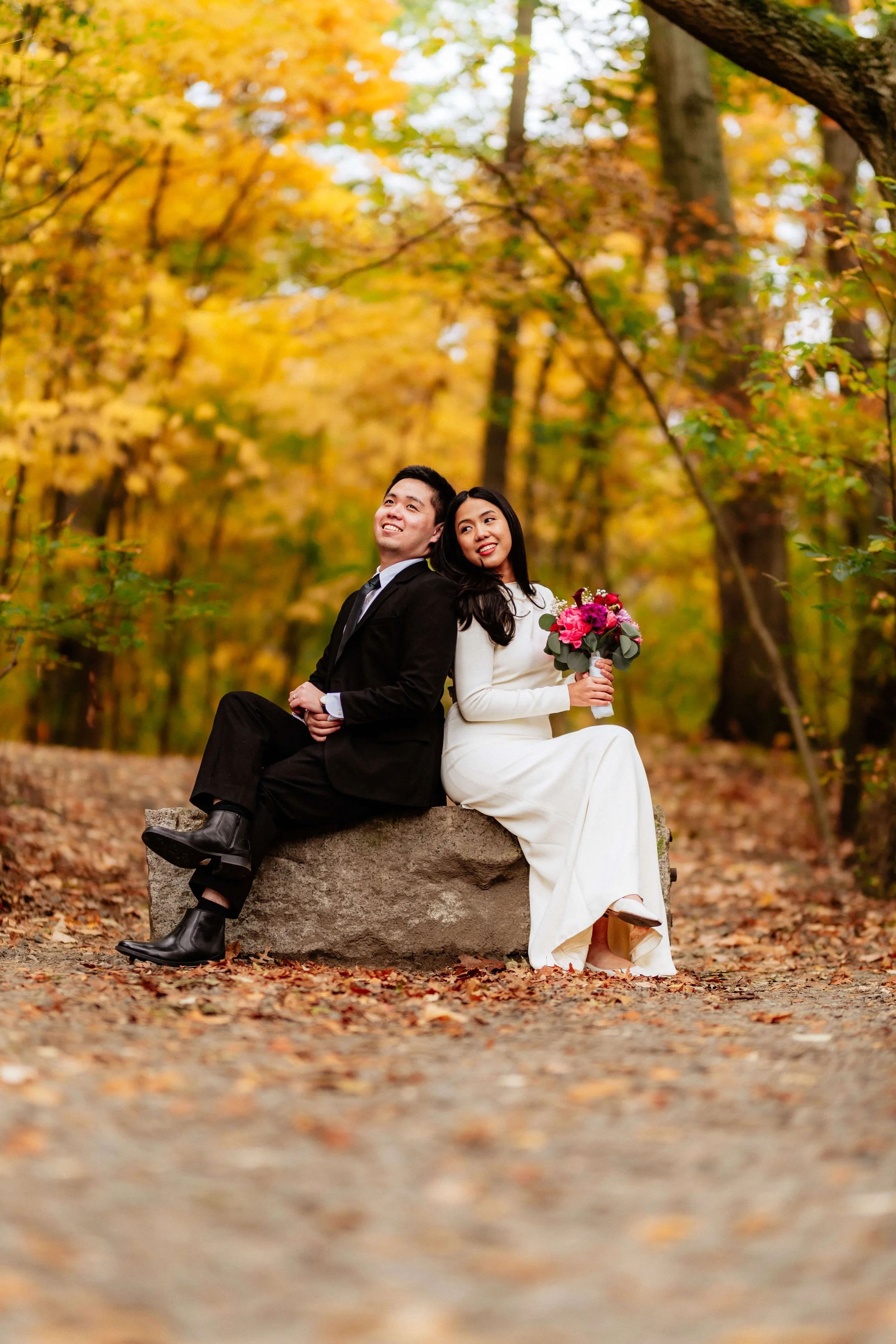 Couple sitting together during a cozy fall couples photography session in Boston.