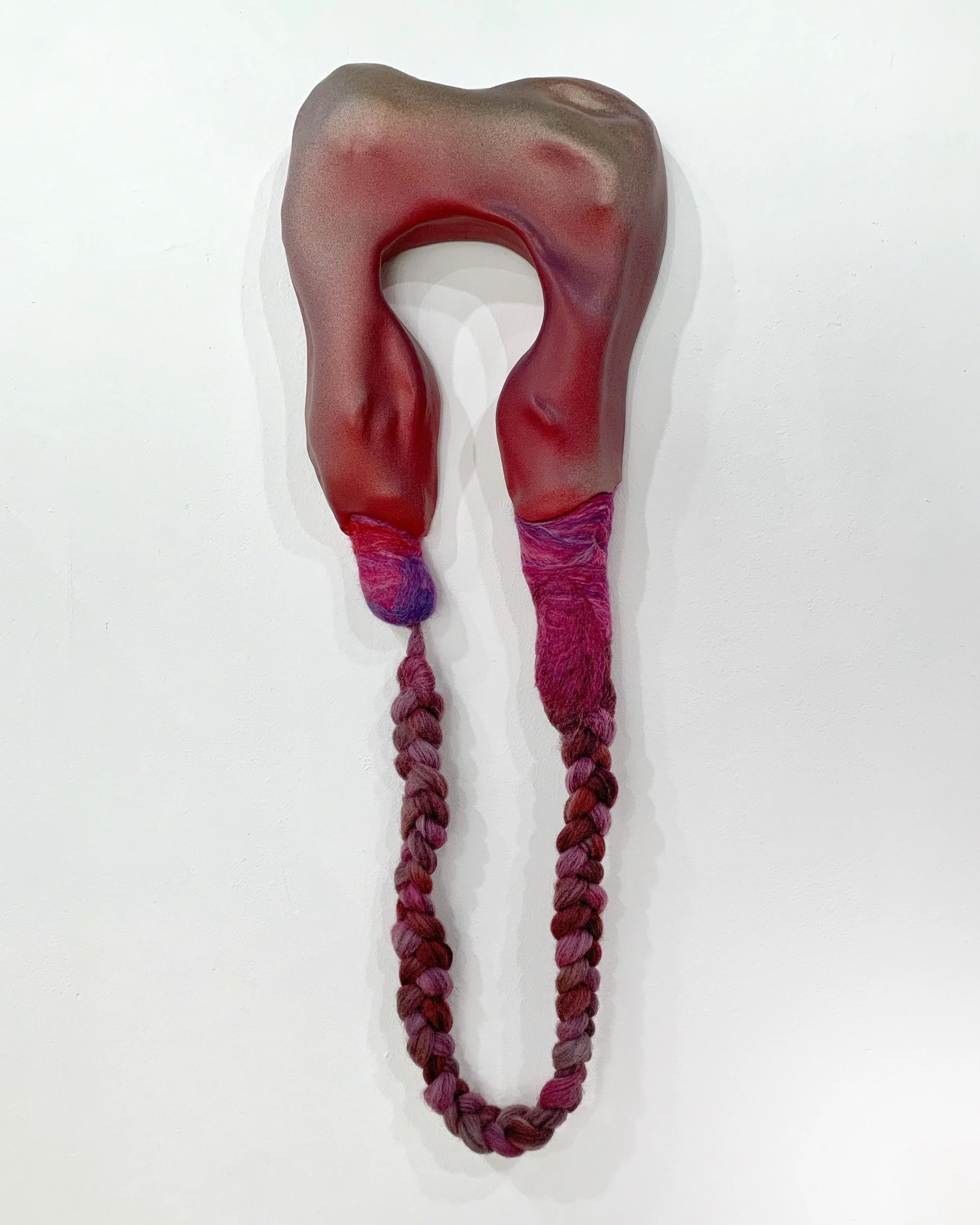Intestines; 2024; ceramic stoneware, glaze, wool  
10" x 24"
