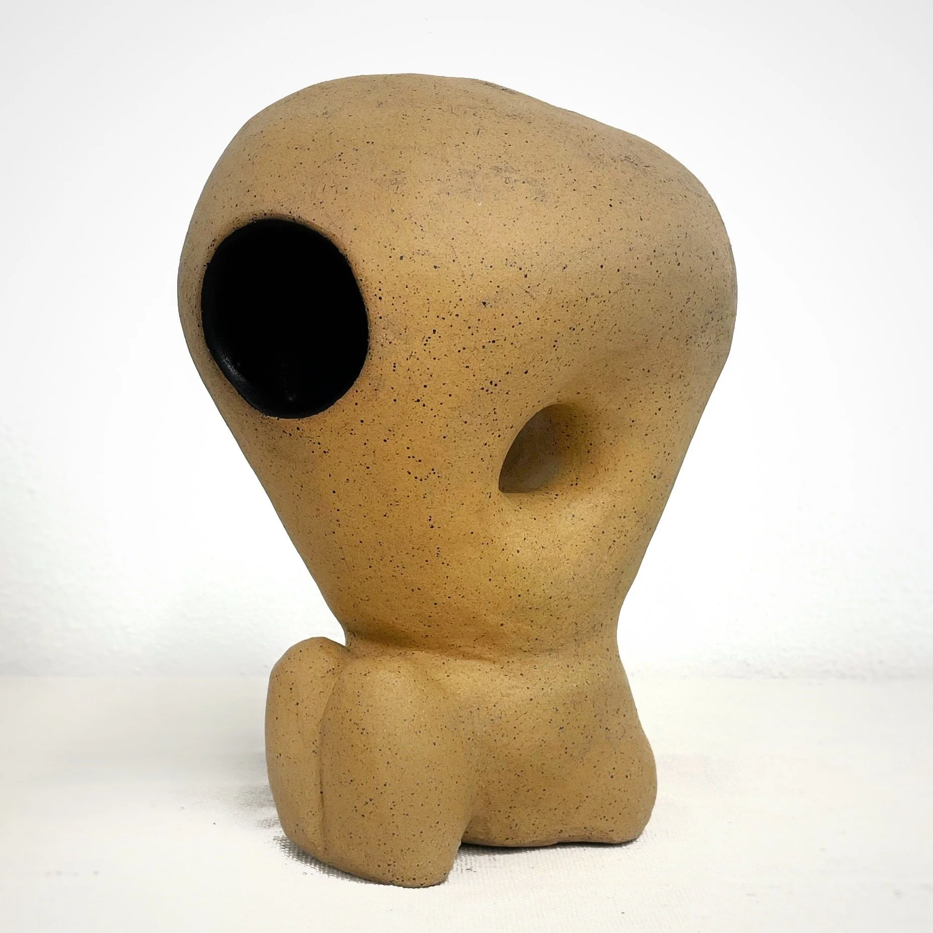 Hayashi-dama no. 9; 2024; ceramic stoneware, underglaze, lightbulb  
7” x 7” x 10"