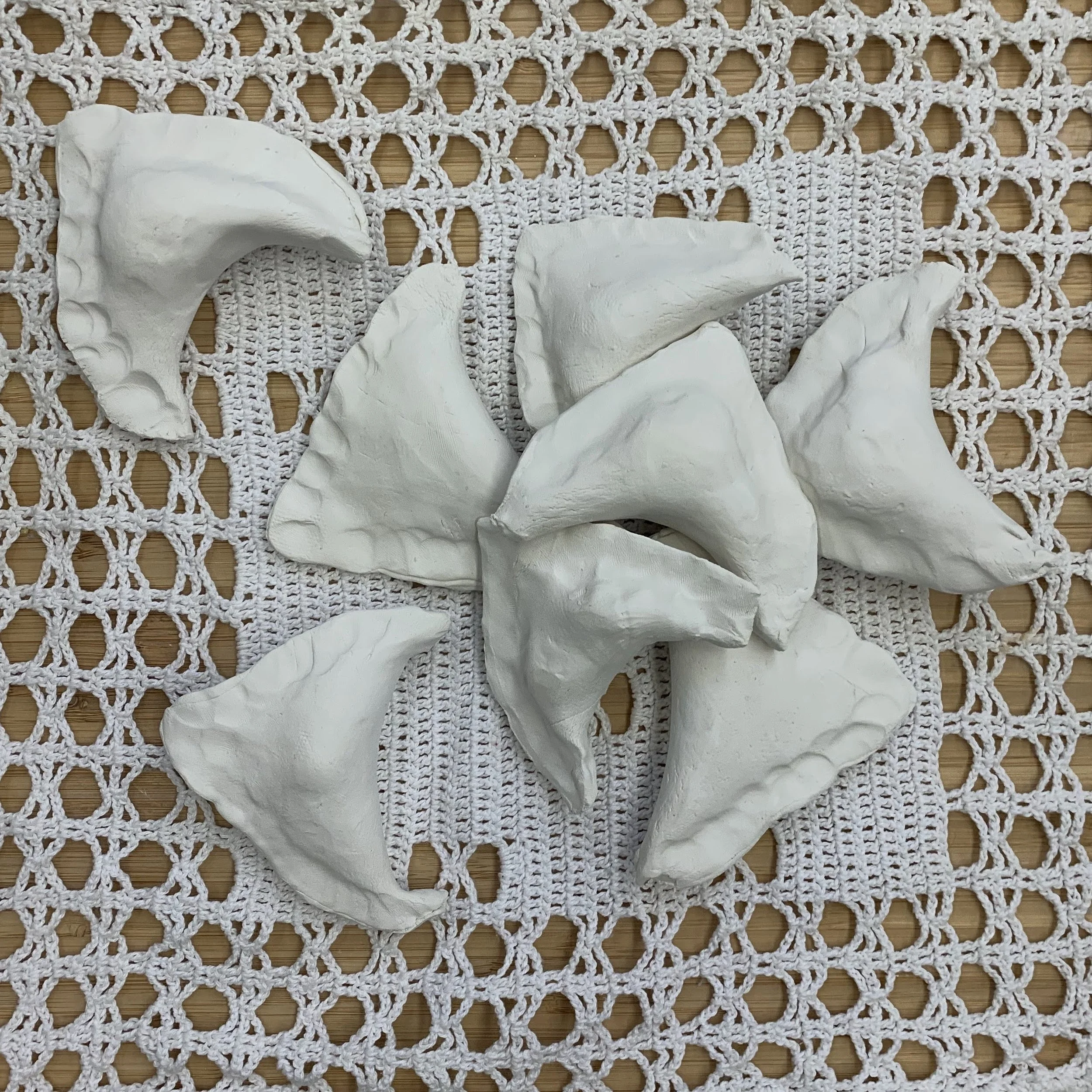 Meltdown (Performance); 2021; unfired porcelain,  cotton doily crochet by artist's grandmother