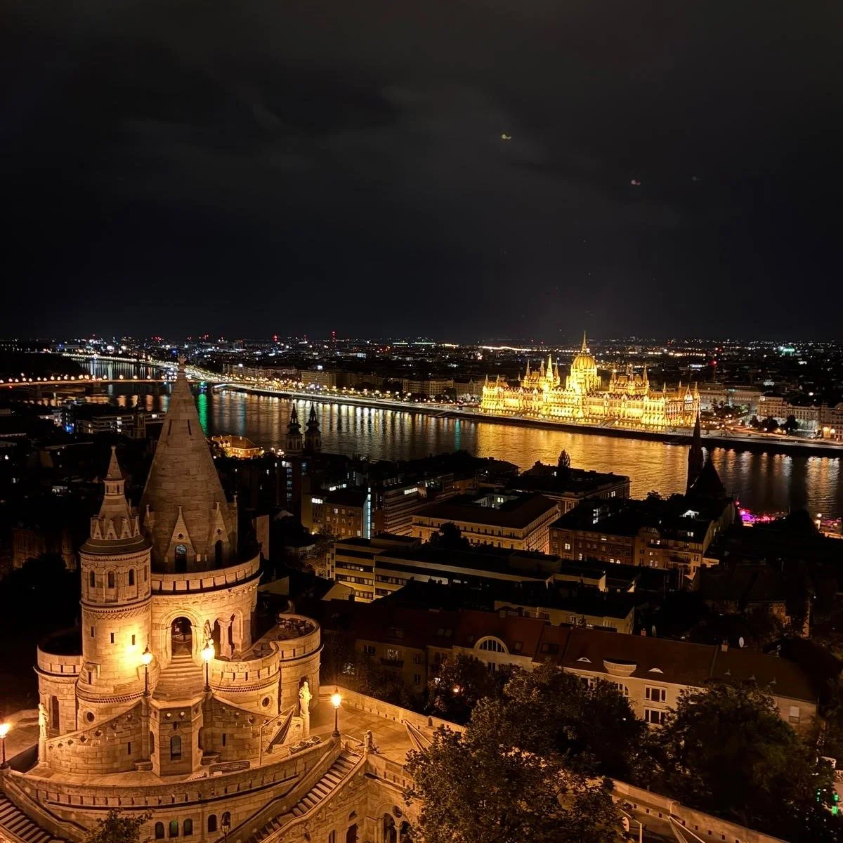 Behold Budapest! A big, bold, beautiful metropolis sliced in two by the dreamy Danube River. Its buildings are massive, including a Parliament resembling a palace and a church that rivals Vienna's with its ornate colored ceramic roof tiles. Cake in o