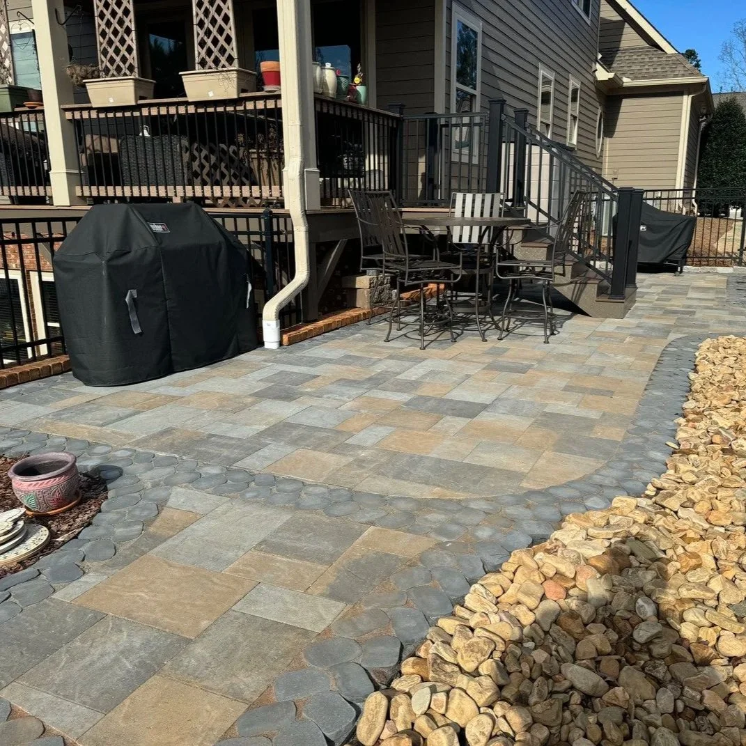 Beautiful paver driveway in Gainesville, GA, showing durable design, proper drainage, and visually appealing pattern for home entrance.