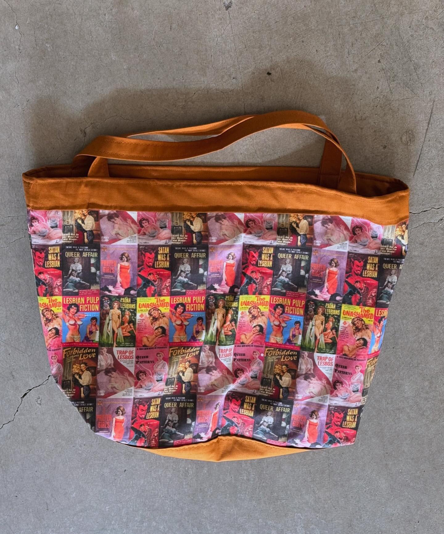 The Lesbrarian style is a bit more subtle&hellip; till you get a closer look. On the outside we&rsquo;ve got an array of smutty, sapphic pulp novel covers while on the inside we&rsquo;ve got a brown and white check reminiscent of an old library floor