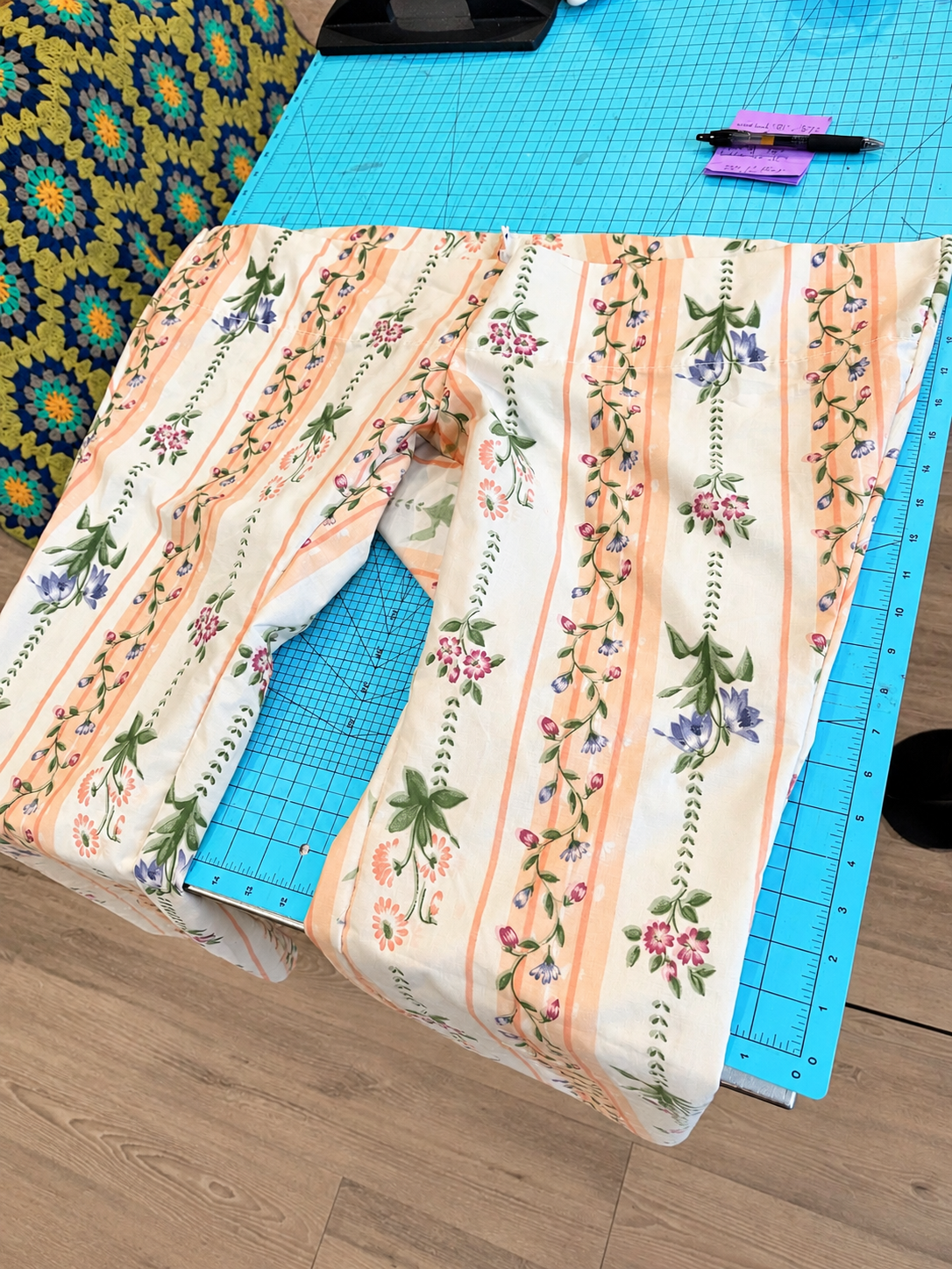 Floral Pants on a Sewing Mat.png