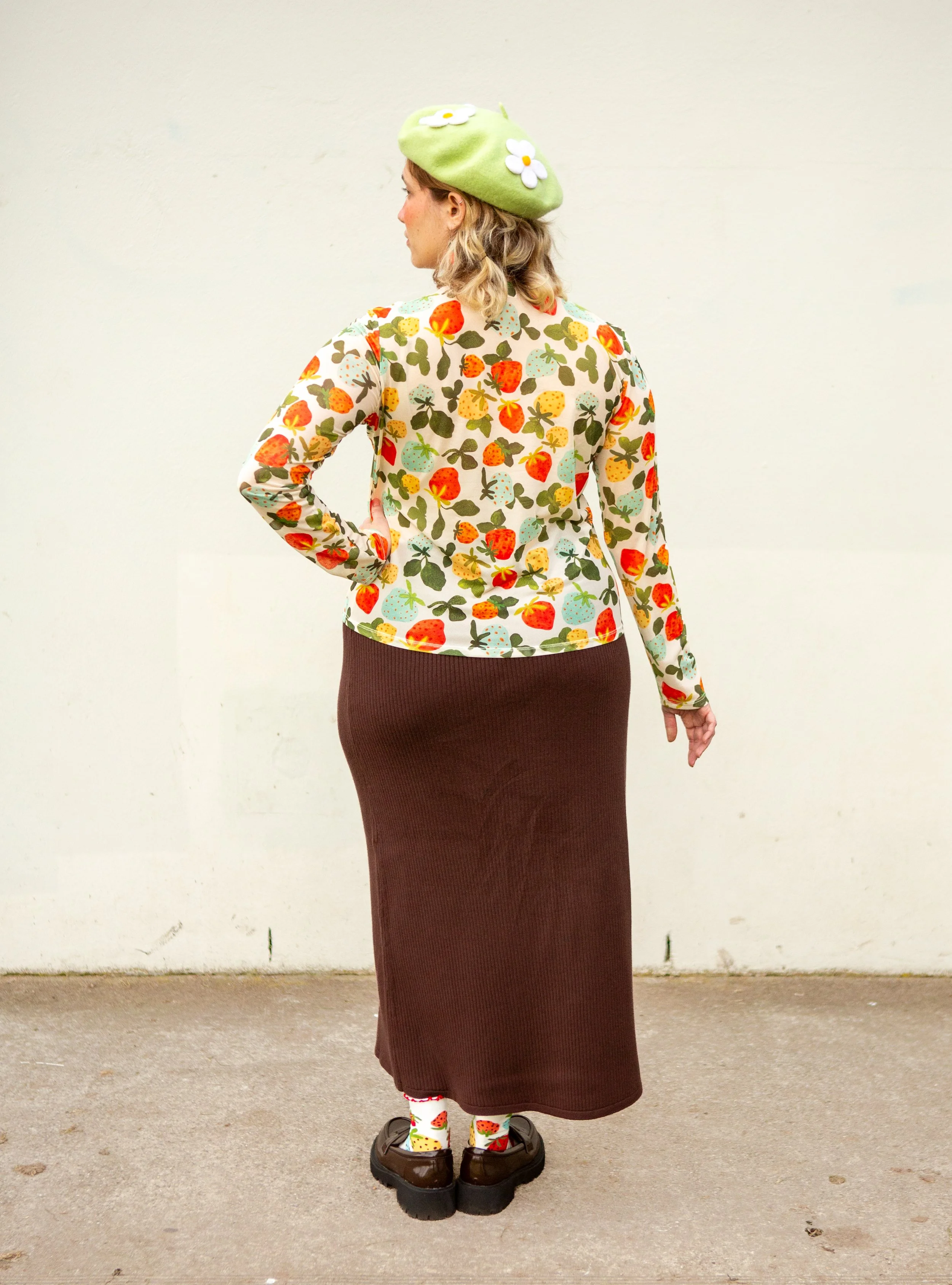 Soft, stretchy mesh top featuring the hand-painted Strawberry Dream print. Made from recycled polyester and ethically produced. Available in sizes 8–20.