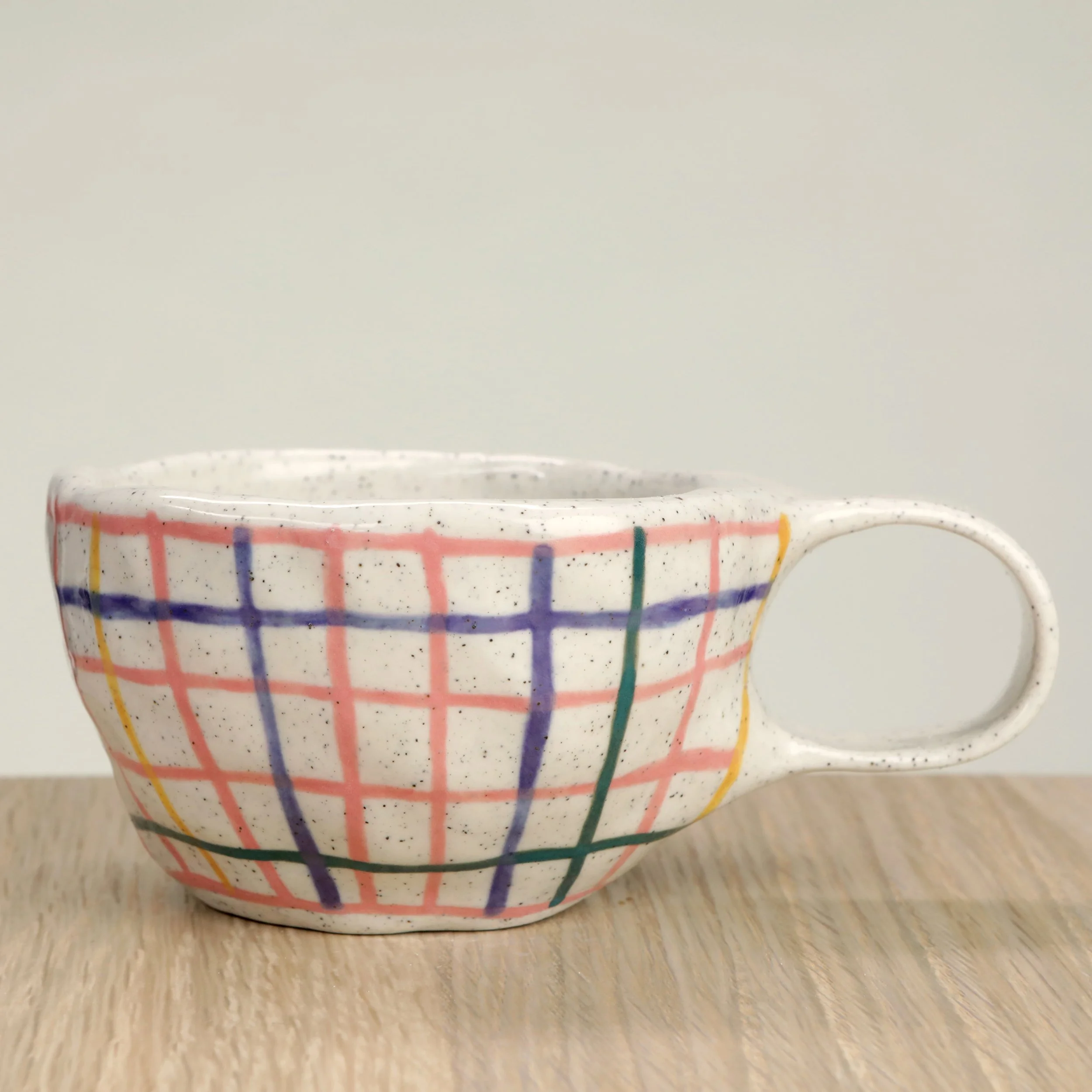 Handmade ceramic coffee cup with hand-painted or pink check & pansy flowers, crafted from speckled clay in Melbourne. Holds approximately 150ml.