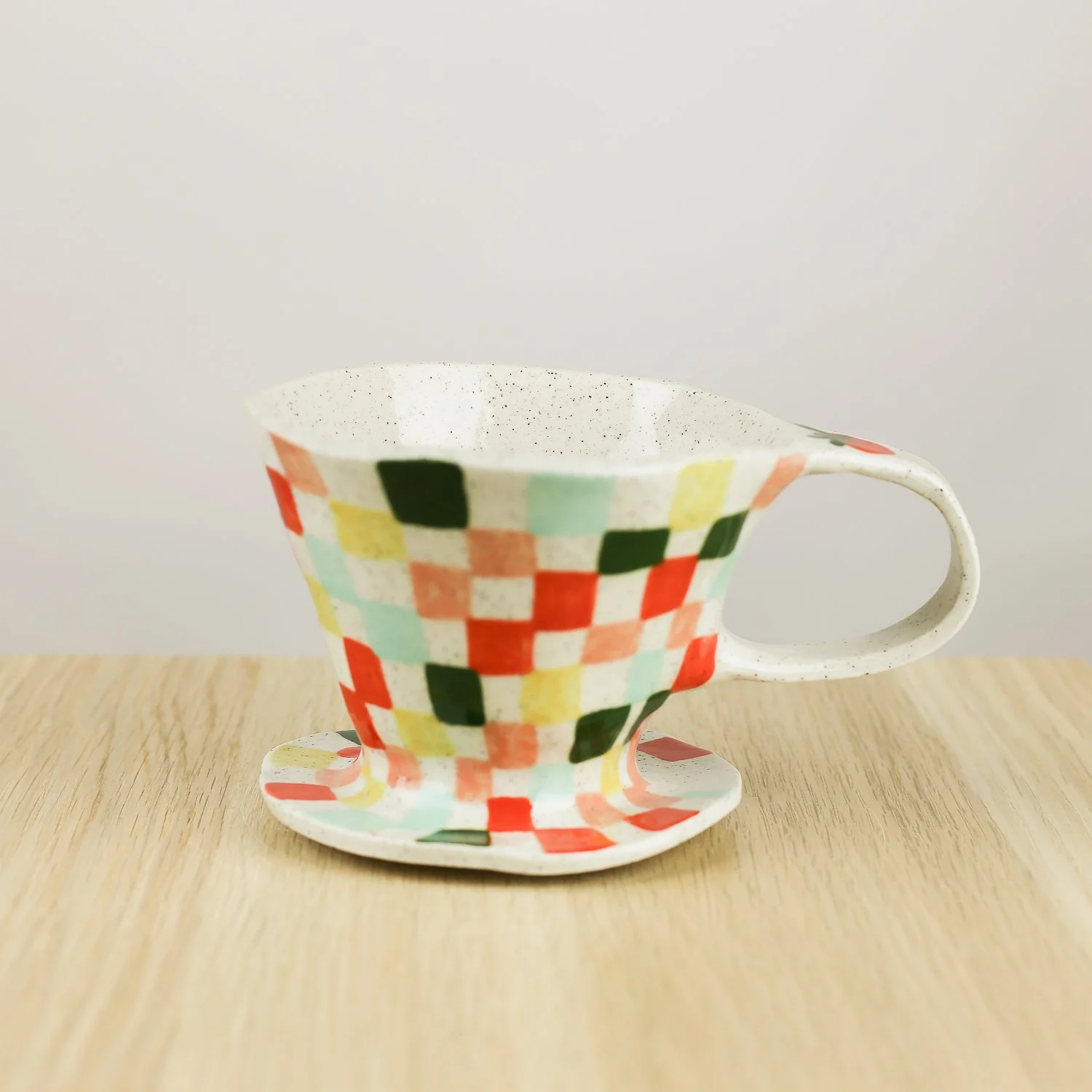 Handmade ceramic coffee dripper with colourful check pattern in red pink yellow and blue, pour over coffee maker by hellomae