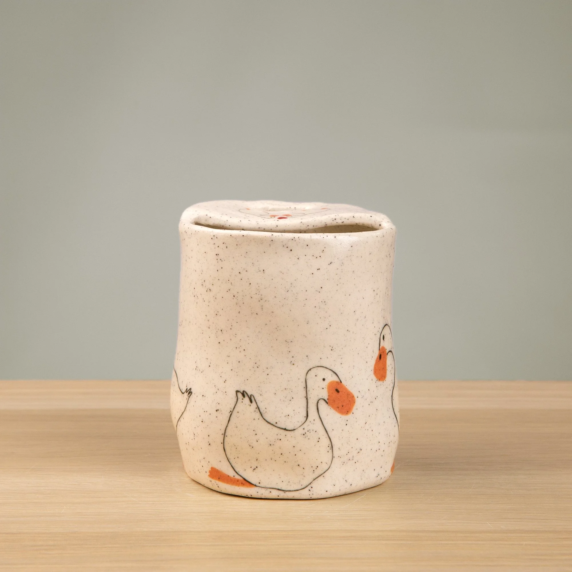 Handmade speckled ceramic loving duck travel cup decorated with cute duck illustrations
