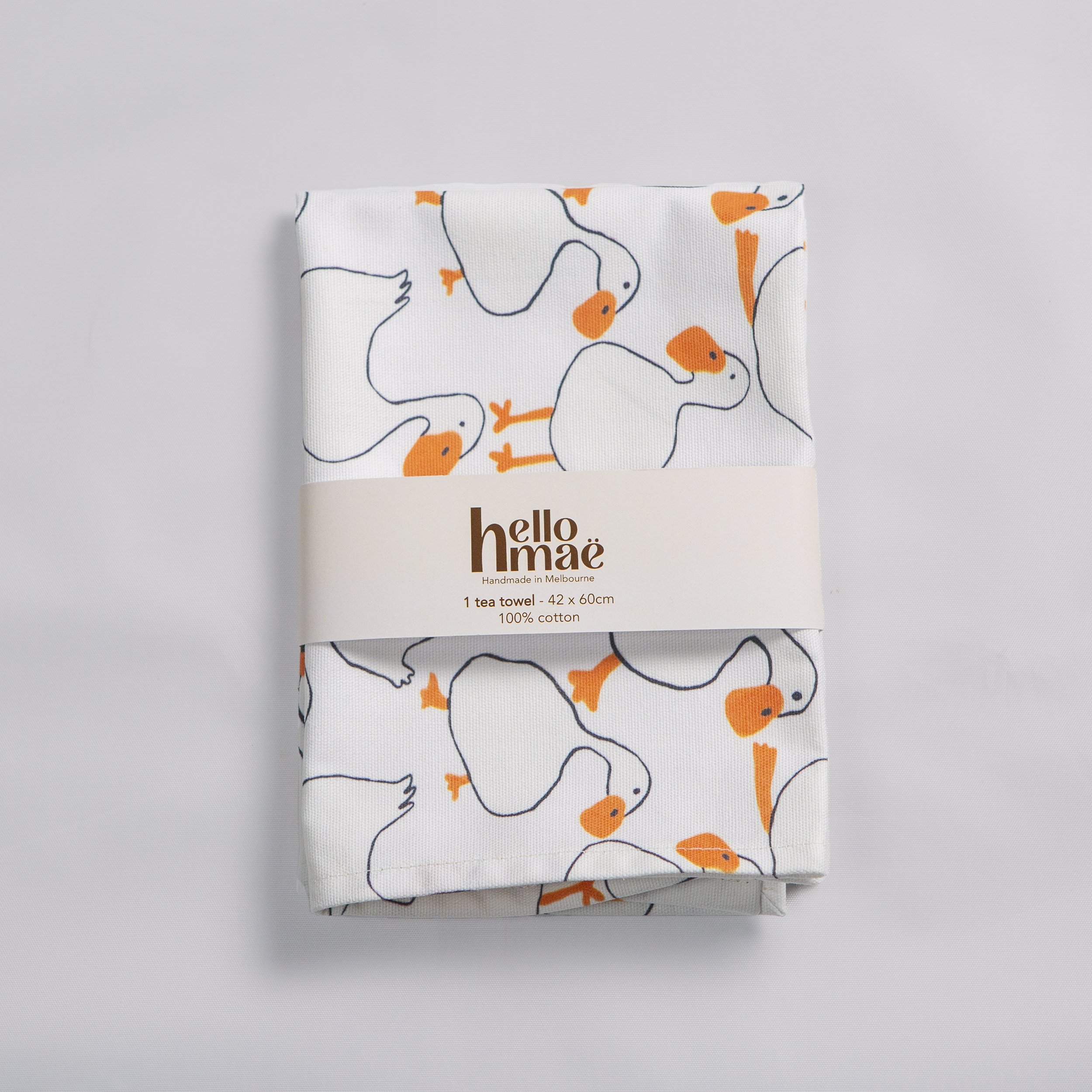 Cotton tea towel featuring a hand-drawn duck print by hellomaë. digitally printed and made in melbourne