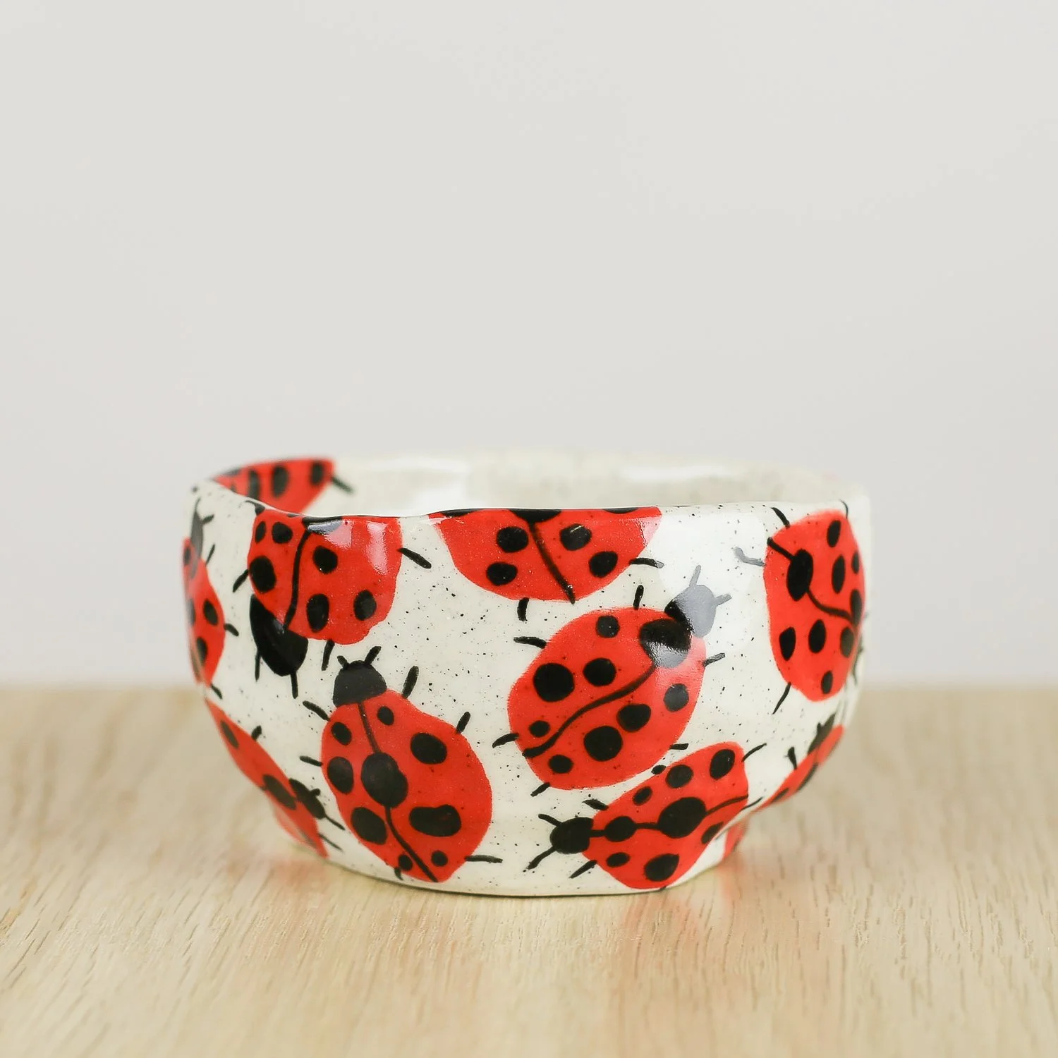 andmade ceramic cup with hand-painted ladybugs. Holds 150ml. A unique, whimsical coffee cup perfect for everyday rituals and thoughtful gifts.