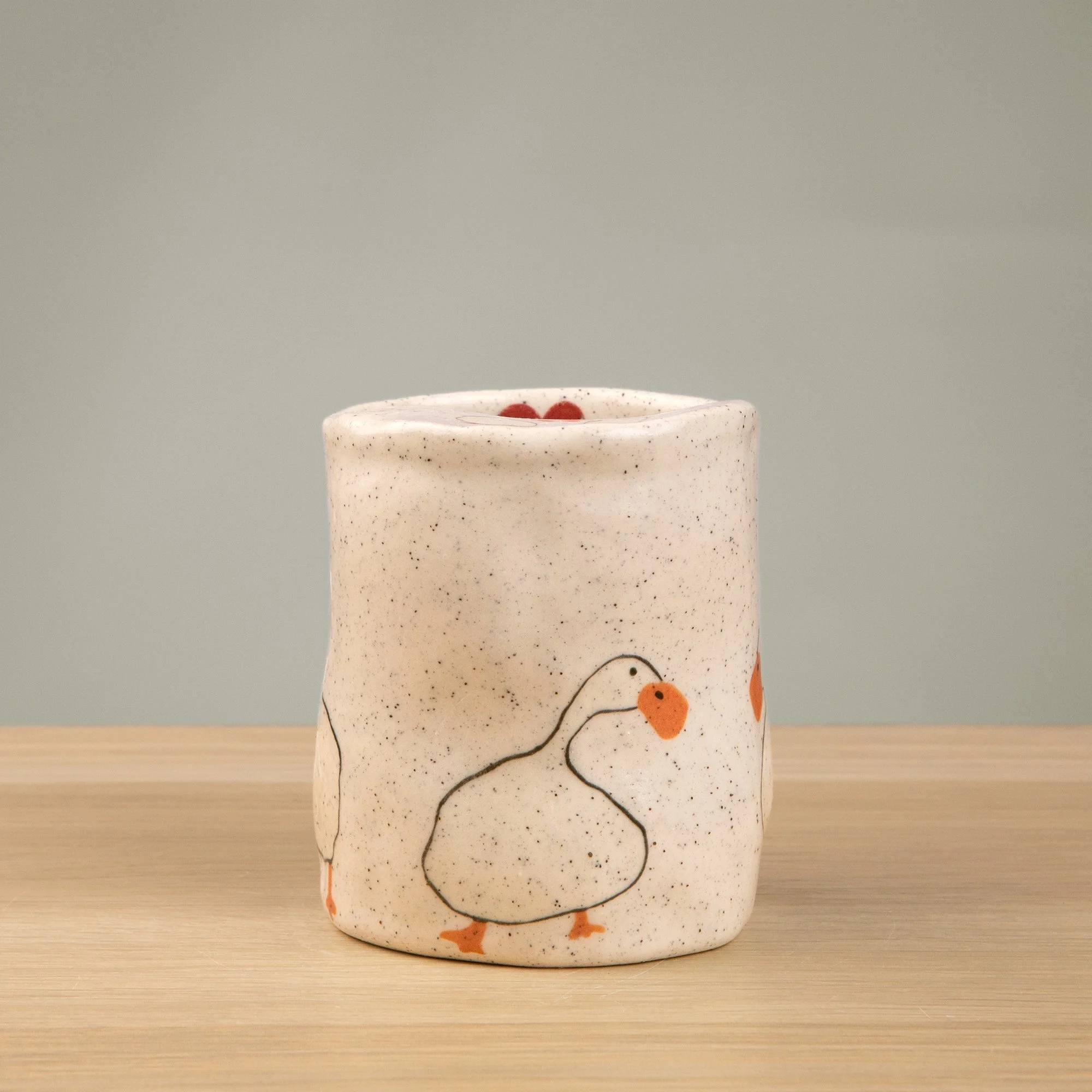 Handmade speckled ceramic loving duck travel cup decorated with cute duck illustrations