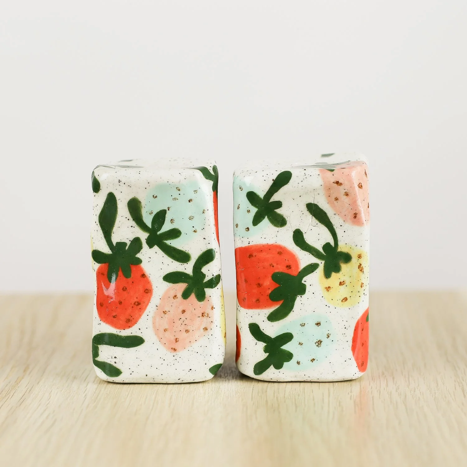 Handmade ceramic salt and pepper shaker set with colourful strawberries by hellomae