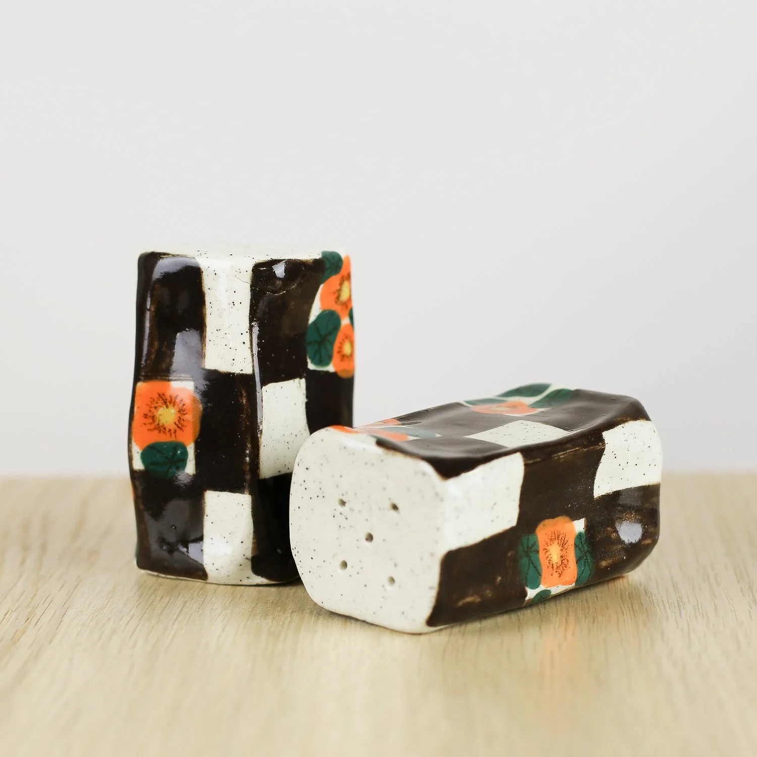 Handmade ceramic salt and pepper shaker set with nasturtium flowers and brown check pattern by hellomae
