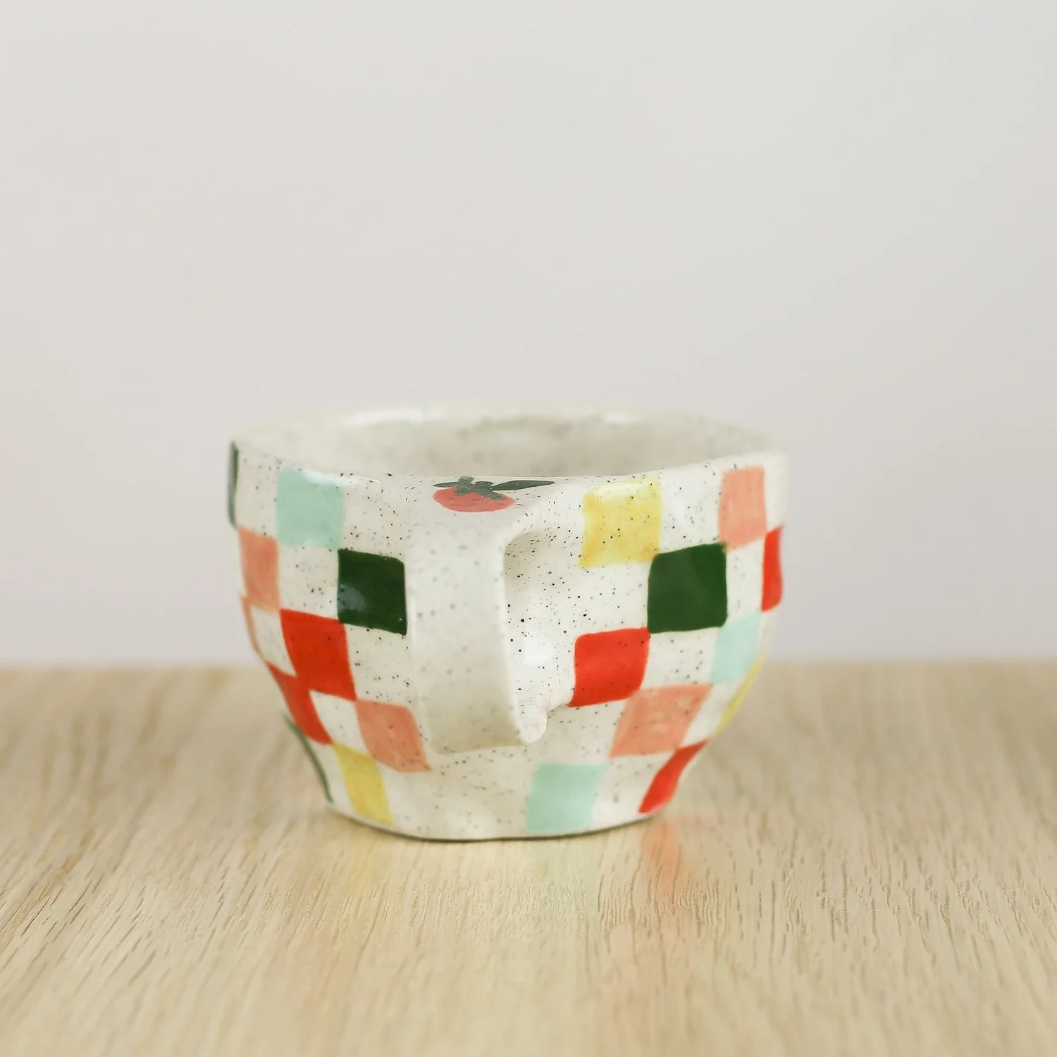 Handmade ceramic cup with colourful check pattern in red pink yellow and blue, 150ml coffee cup by Hello Mae