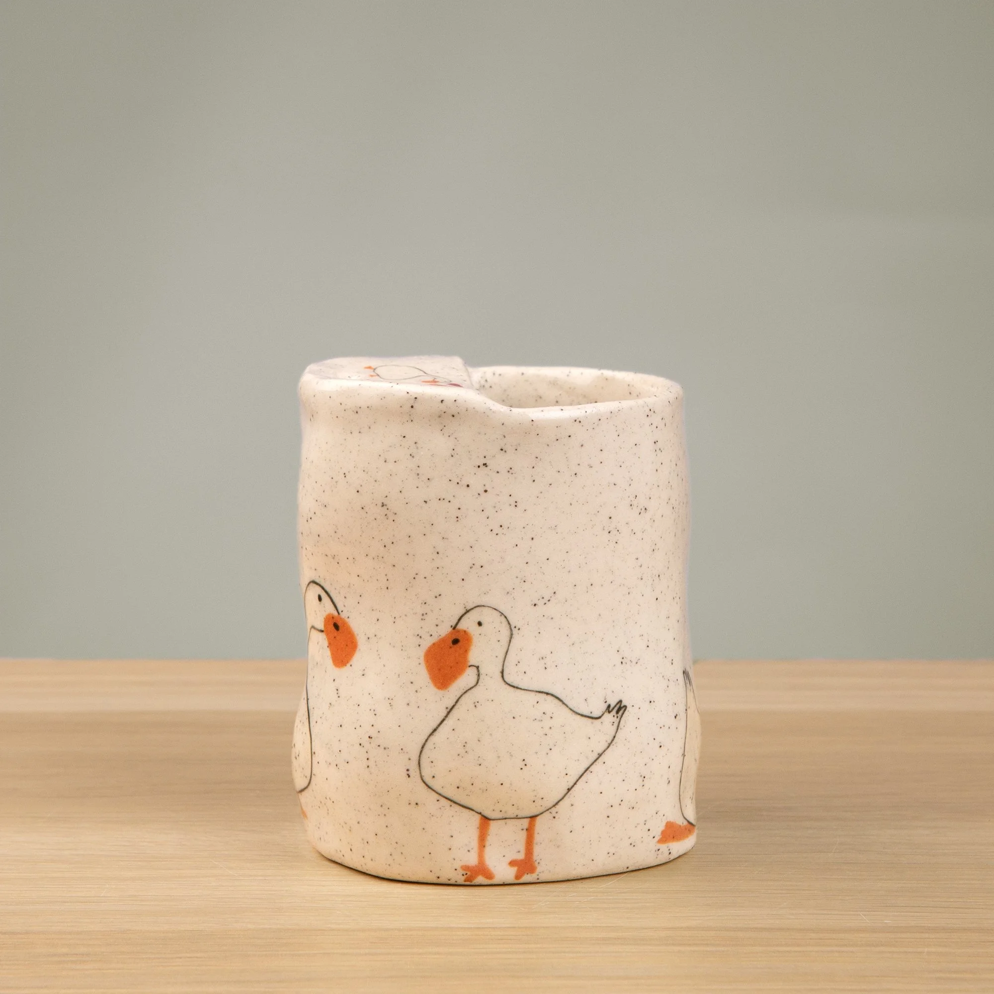 Handmade speckled ceramic loving duck travel cup decorated with cute duck illustrations