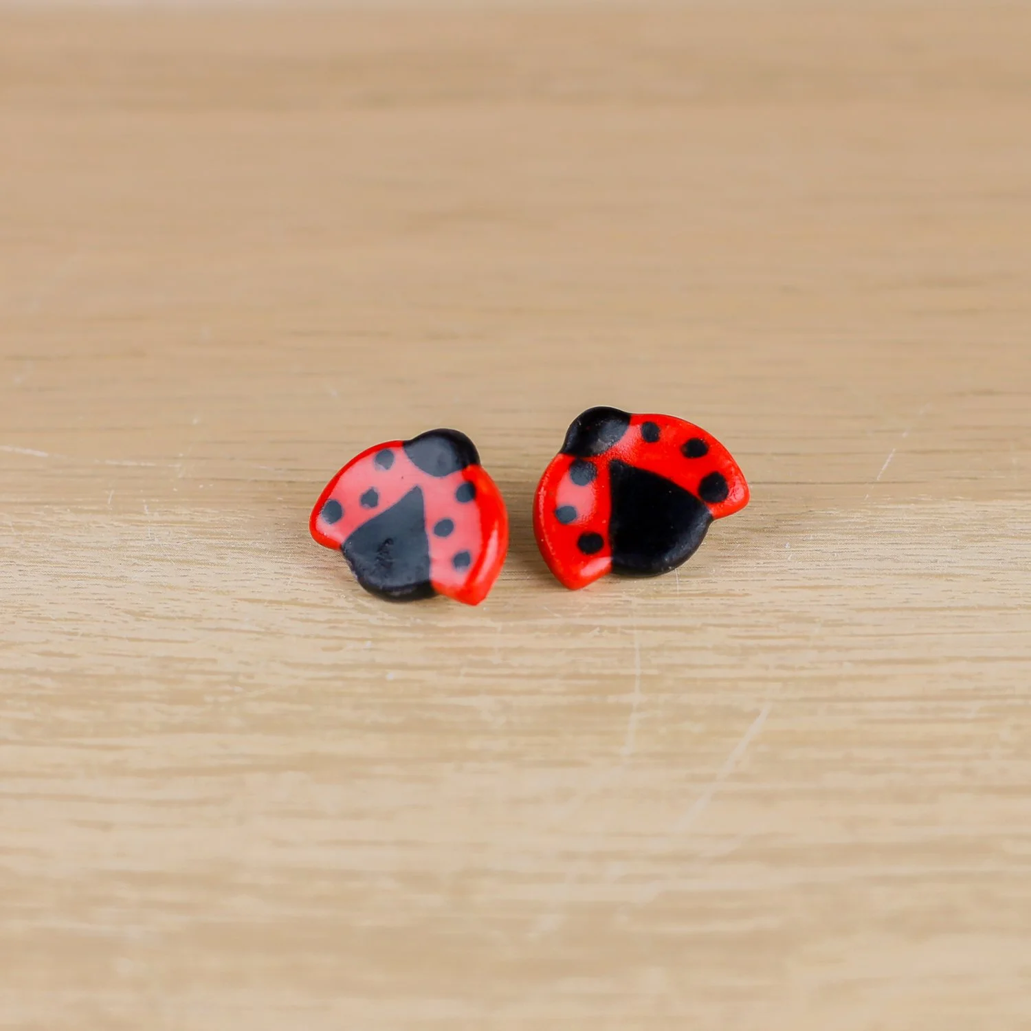 Handmade ceramic ladybug stud earrings with surgical steel posts by helloame