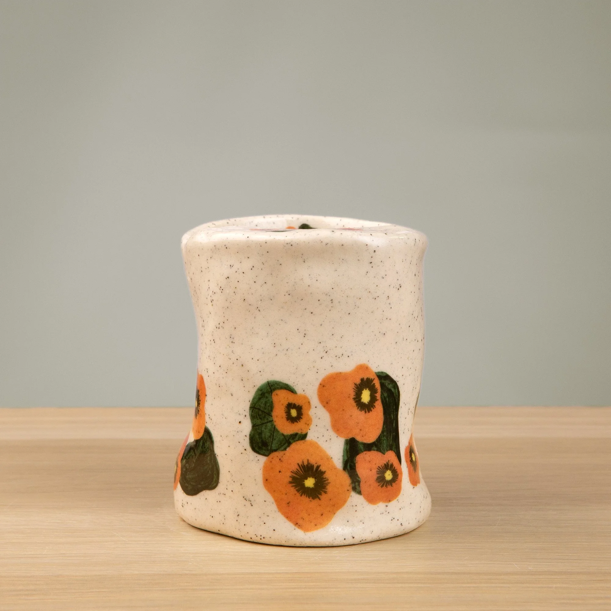 Handmade speckled ceramic nasturtium travel cup decorated with sweet nasturtiums