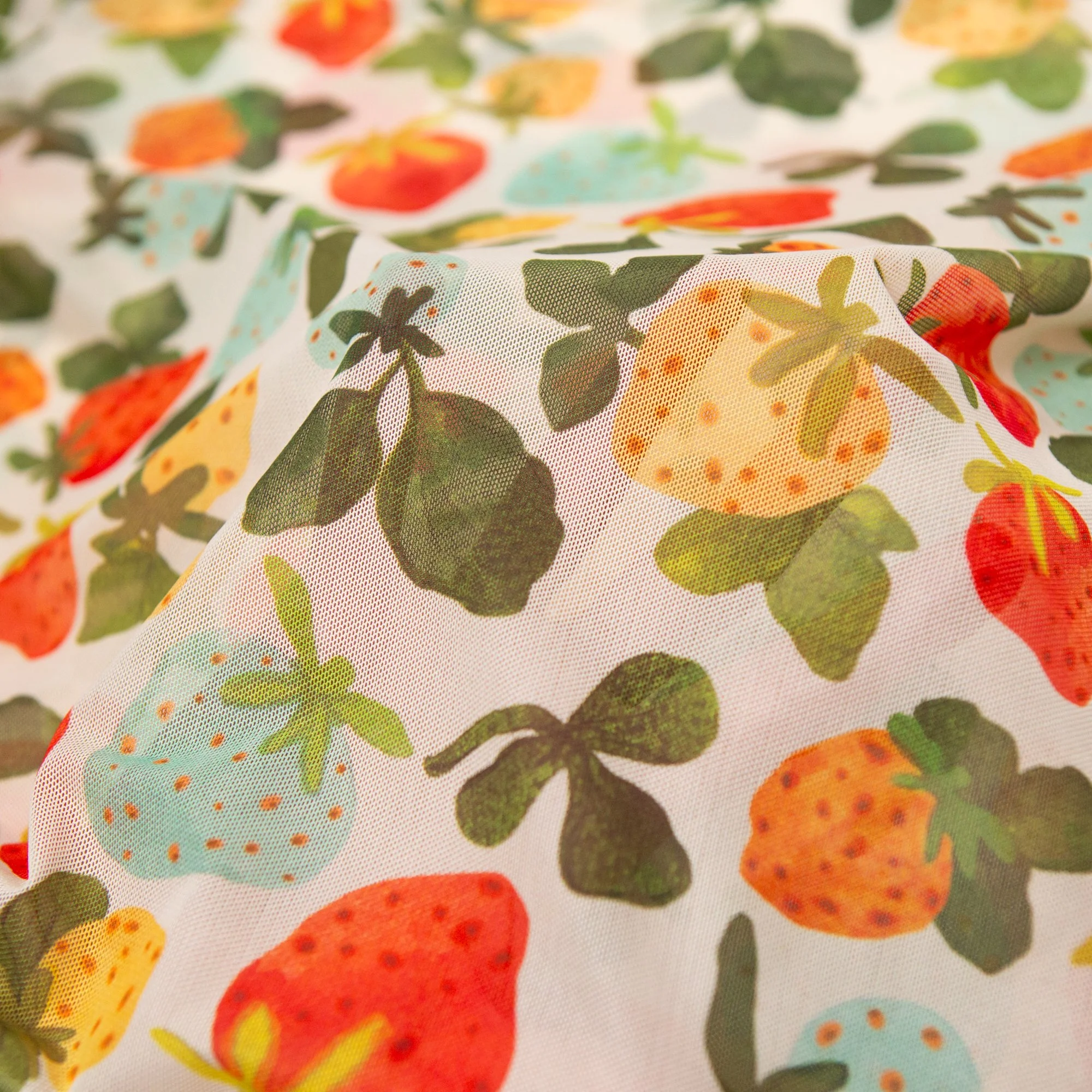 Soft, stretchy mesh top featuring the hand-painted Strawberry Dream print. Made from recycled polyester and ethically produced. Available in sizes 8–20.