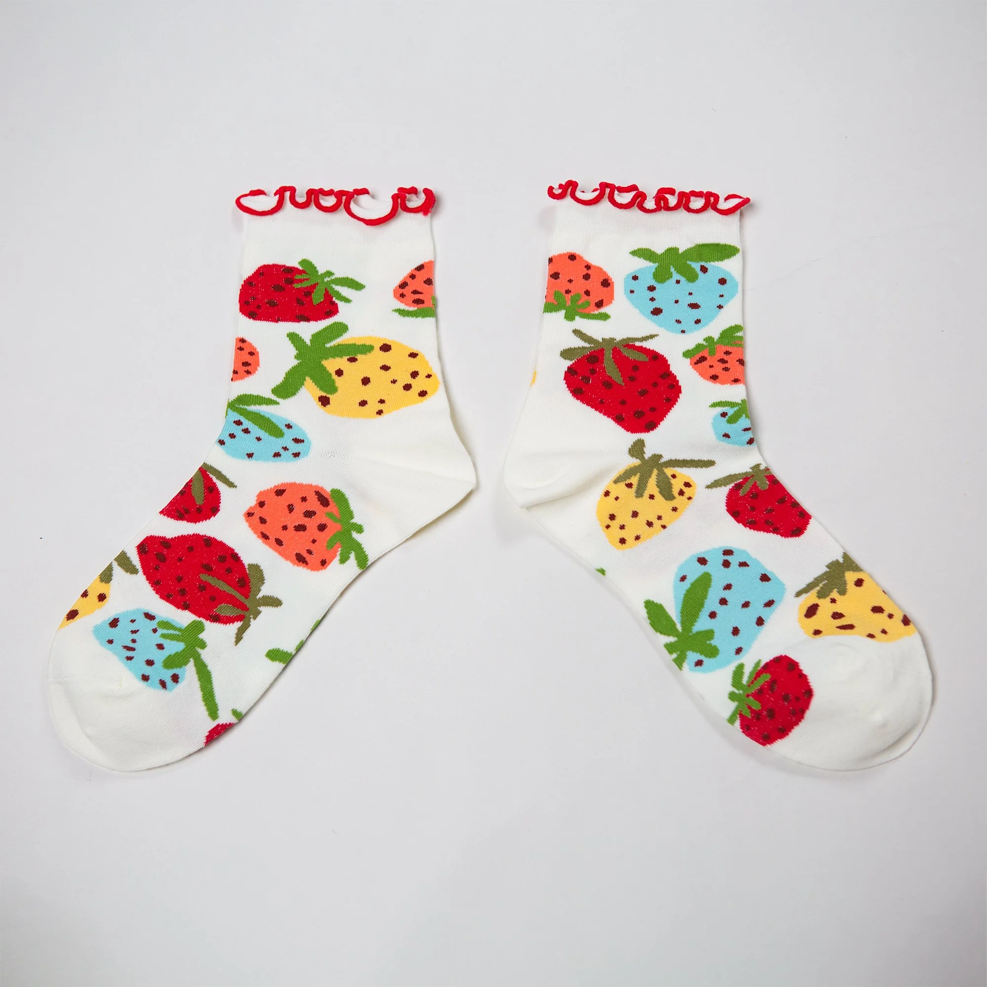Soft ankle socks featuring the hand-painted Strawberry Dream print and a playful red frill. Comfortable, colourful and perfect for everyday wear.