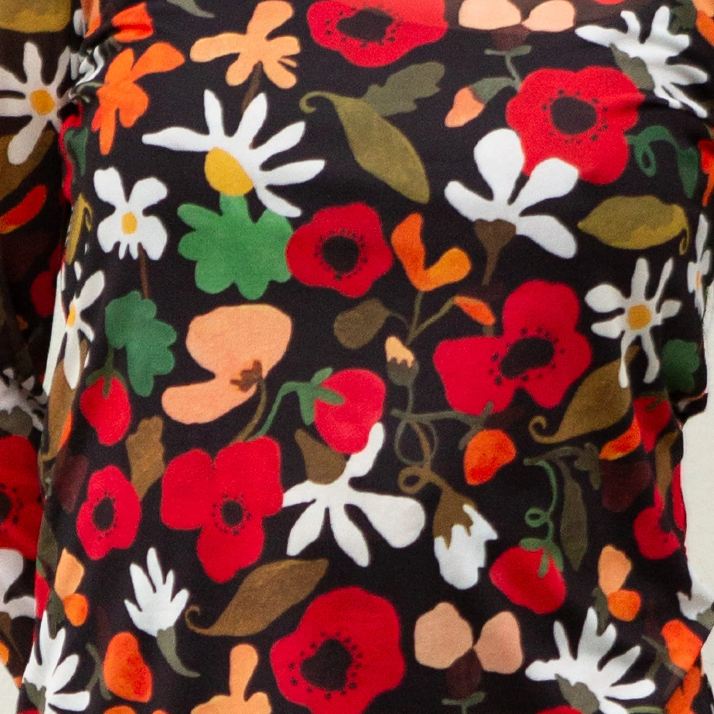 Soft, stretchy mesh top featuring the hand-painted Flower Daze print. Made from recycled polyester and ethically produced. Available in sizes 8–20.