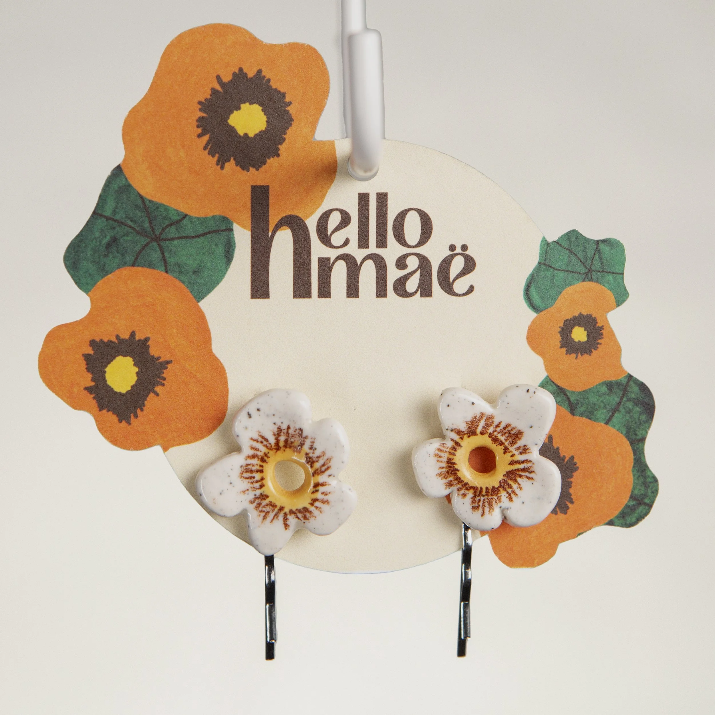 A set of two ceramic hair pins – 2 white flowers, handmade and painted.