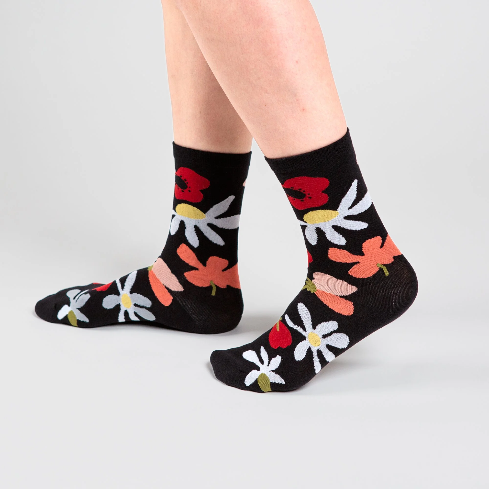 Soft crew socks featuring the hand-painted Flower Daze print. Comfortable, colourful and perfect for adding a playful touch to your everyday wardrobe.