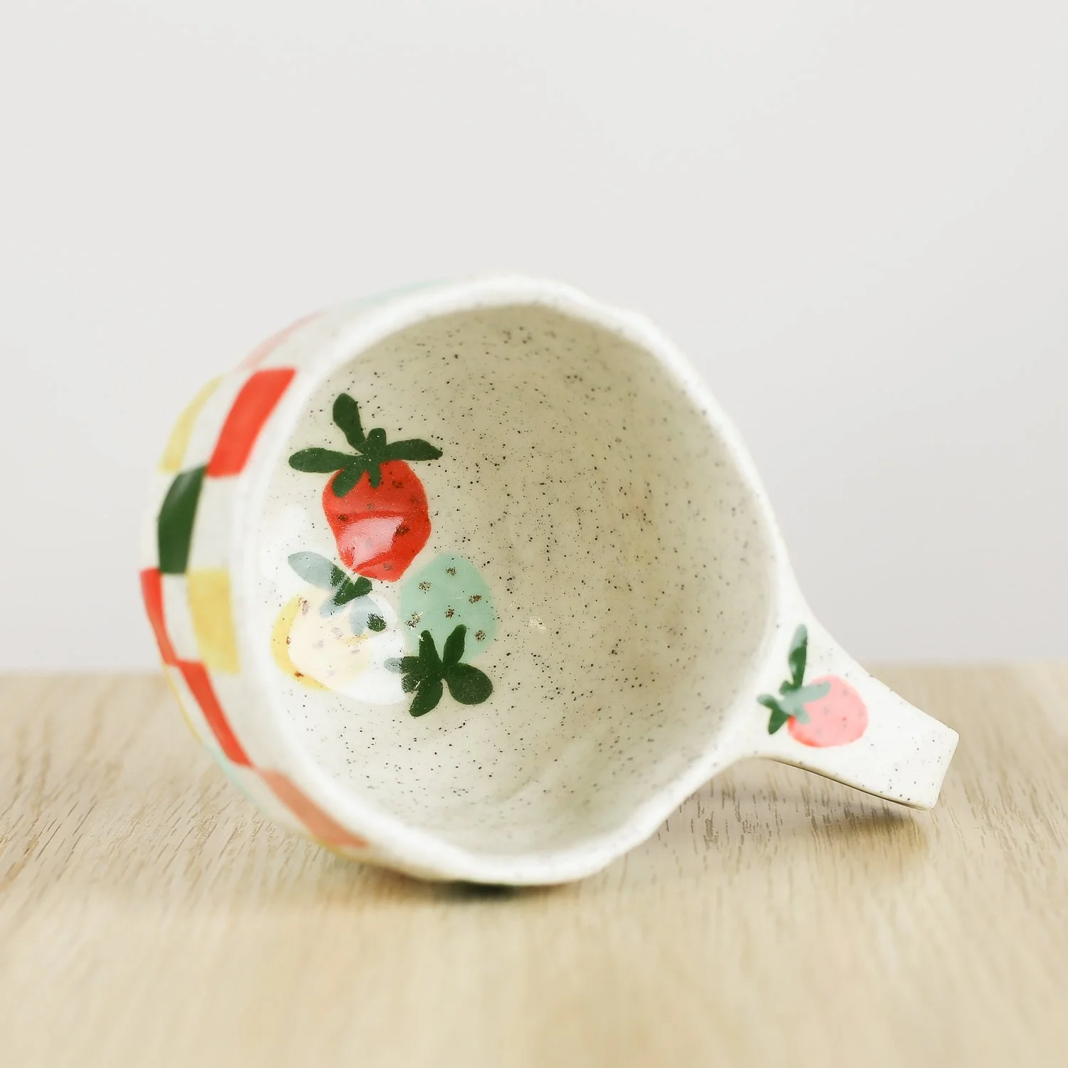 Handmade ceramic cup with colourful check pattern in red pink yellow and blue, 150ml coffee cup by Hello Mae