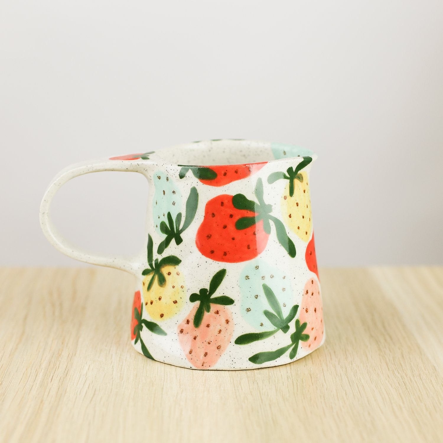 Handmade ceramic jug with colourful strawberries, 350ml milk jug by hellomae