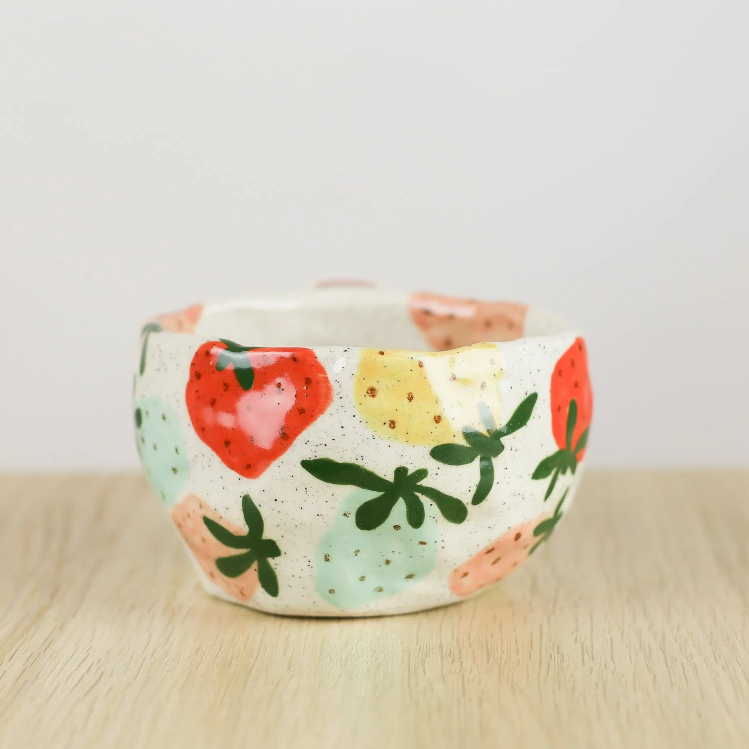 Handmade ceramic mug with colourful strawberries in red pink yellow and blue, 300ml mug by Hello Mae