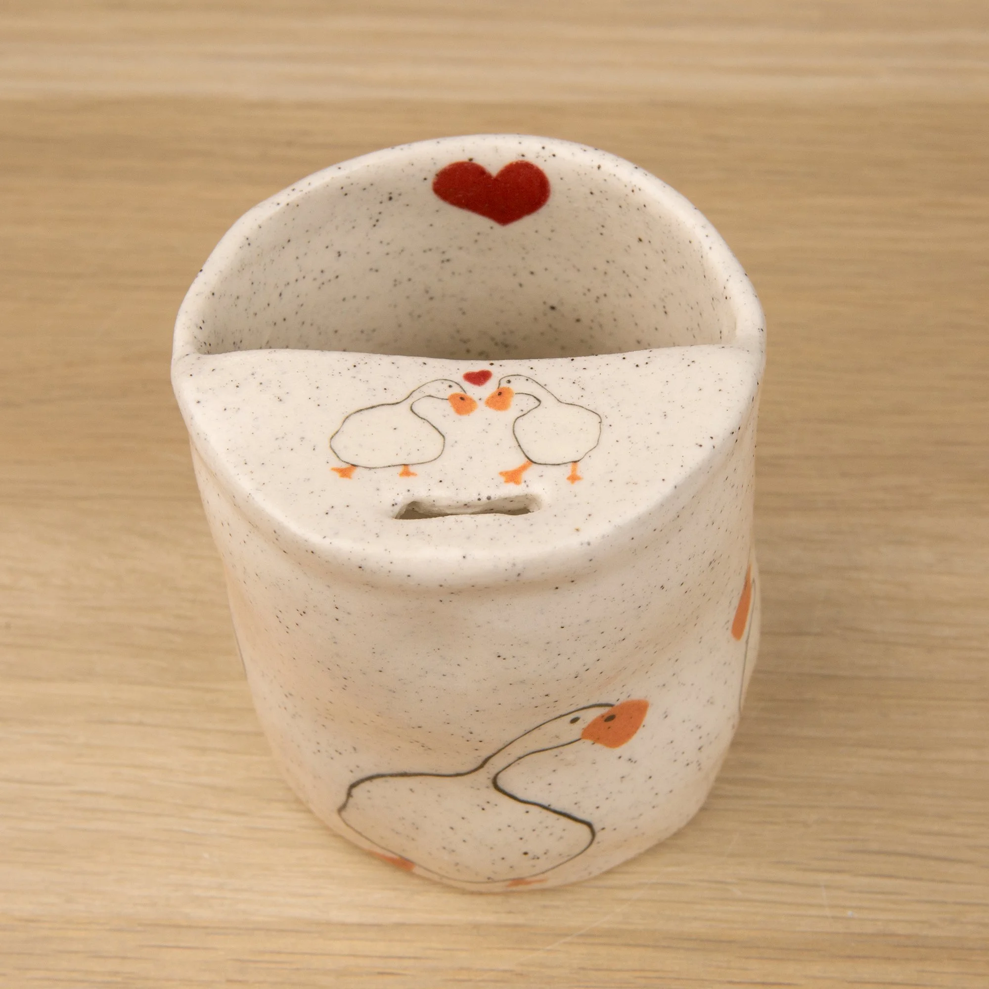 Handmade speckled ceramic loving duck travel cup decorated with cute duck illustrations