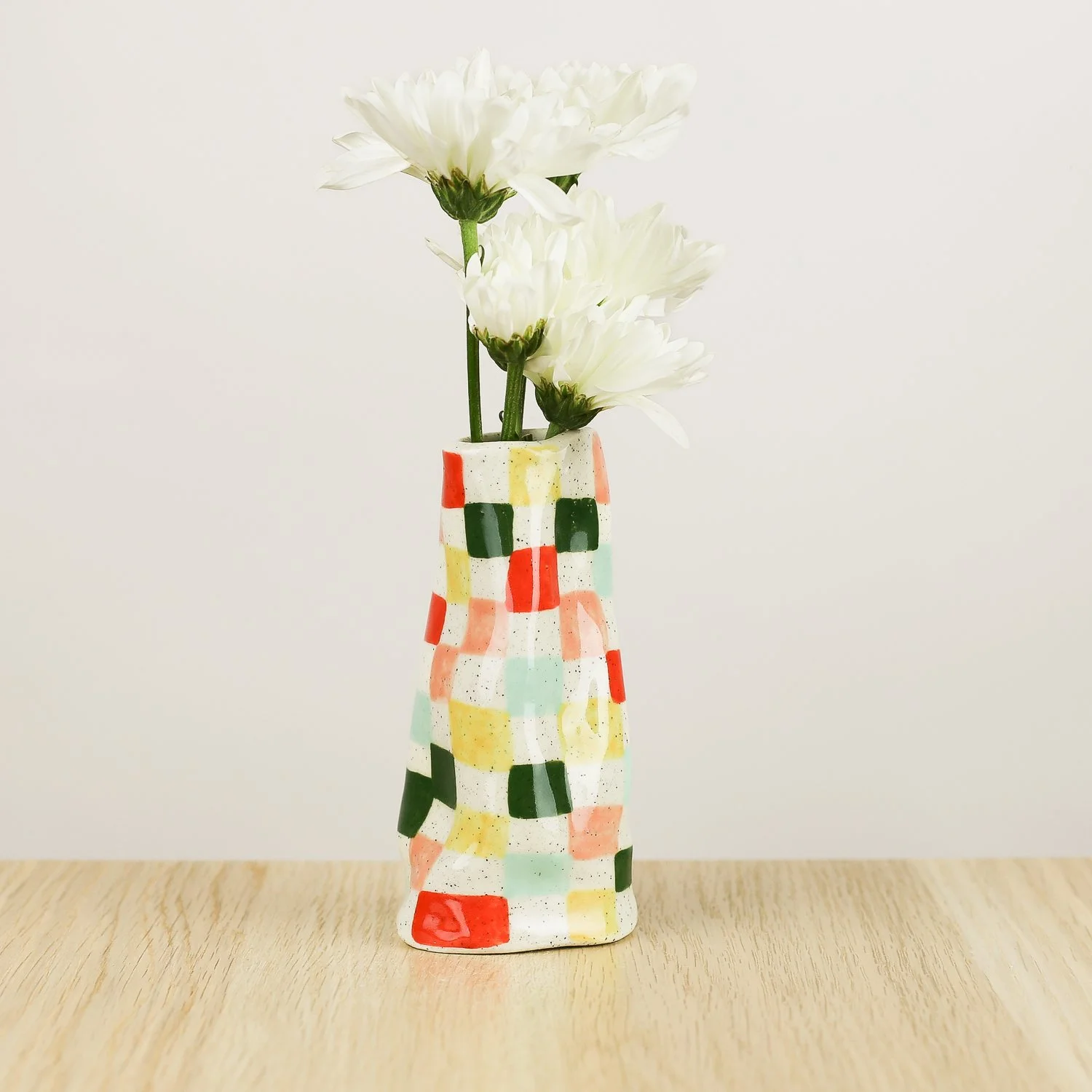 Handmade ceramic mini vase with colourful check pattern in red pink yellow and blue, bud vase by hellomae