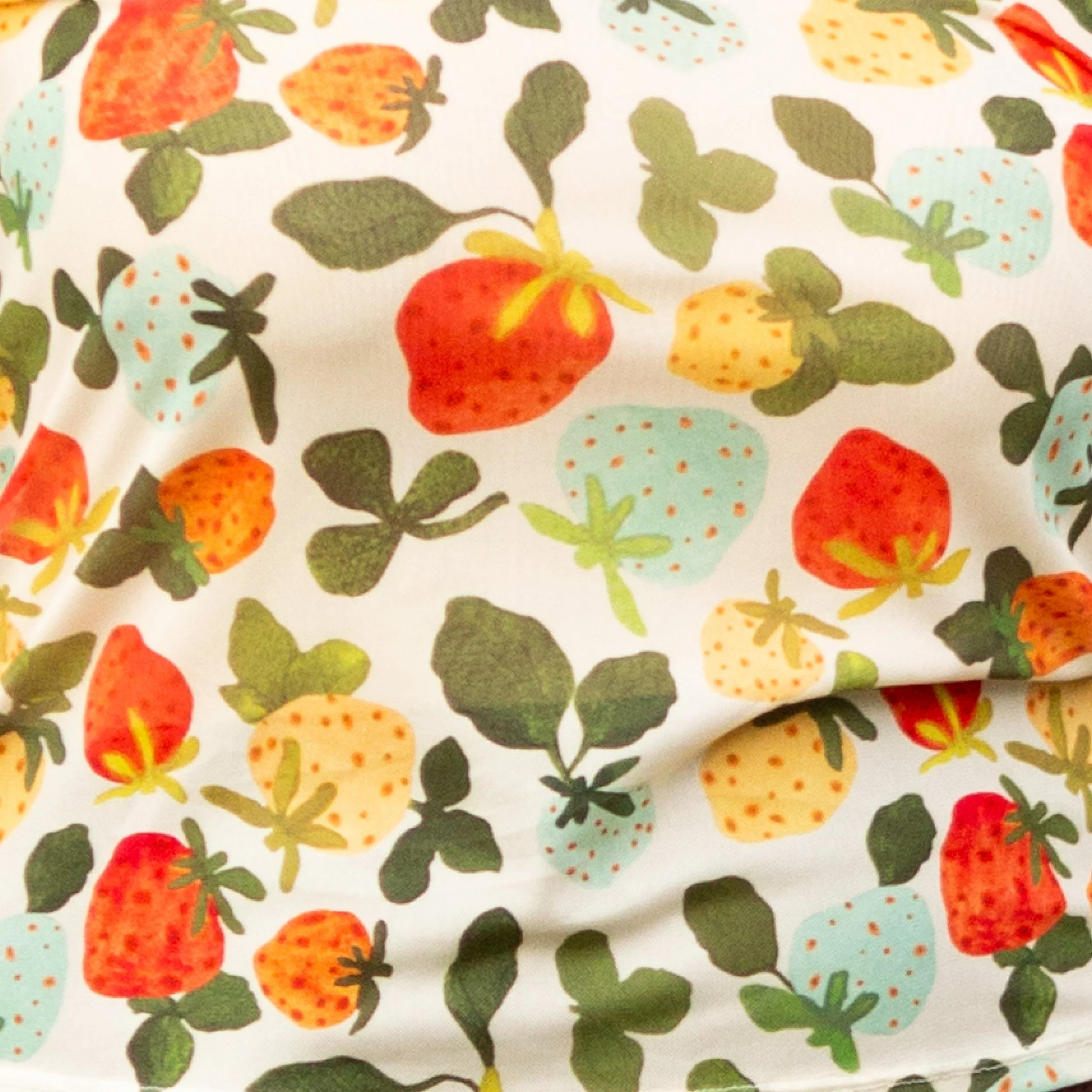 Soft, stretchy mesh top featuring the hand-painted Strawberry Dream print. Made from recycled polyester and ethically produced. Available in sizes 8–20.