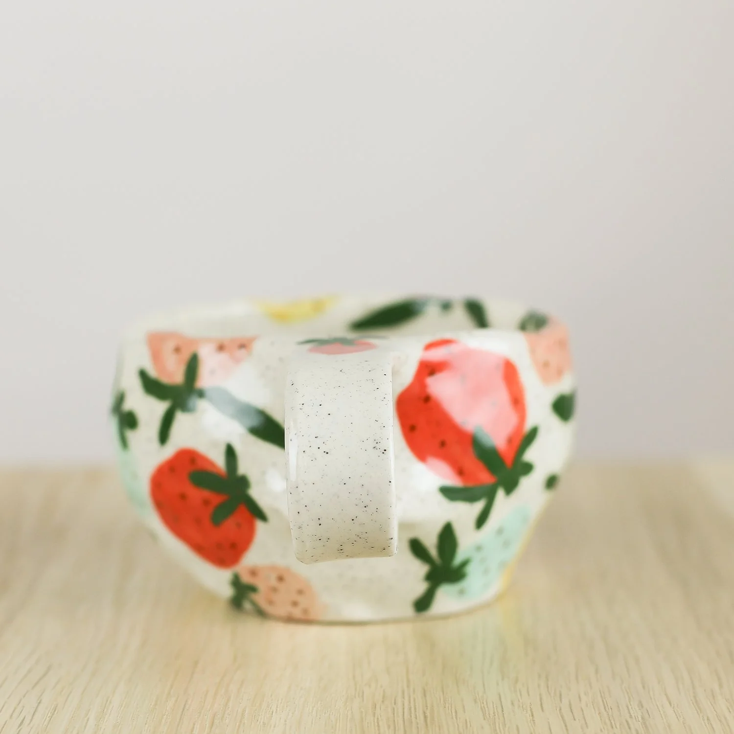 Handmade ceramic mug with colourful strawberries in red pink yellow and blue, 300ml mug by Hello Mae