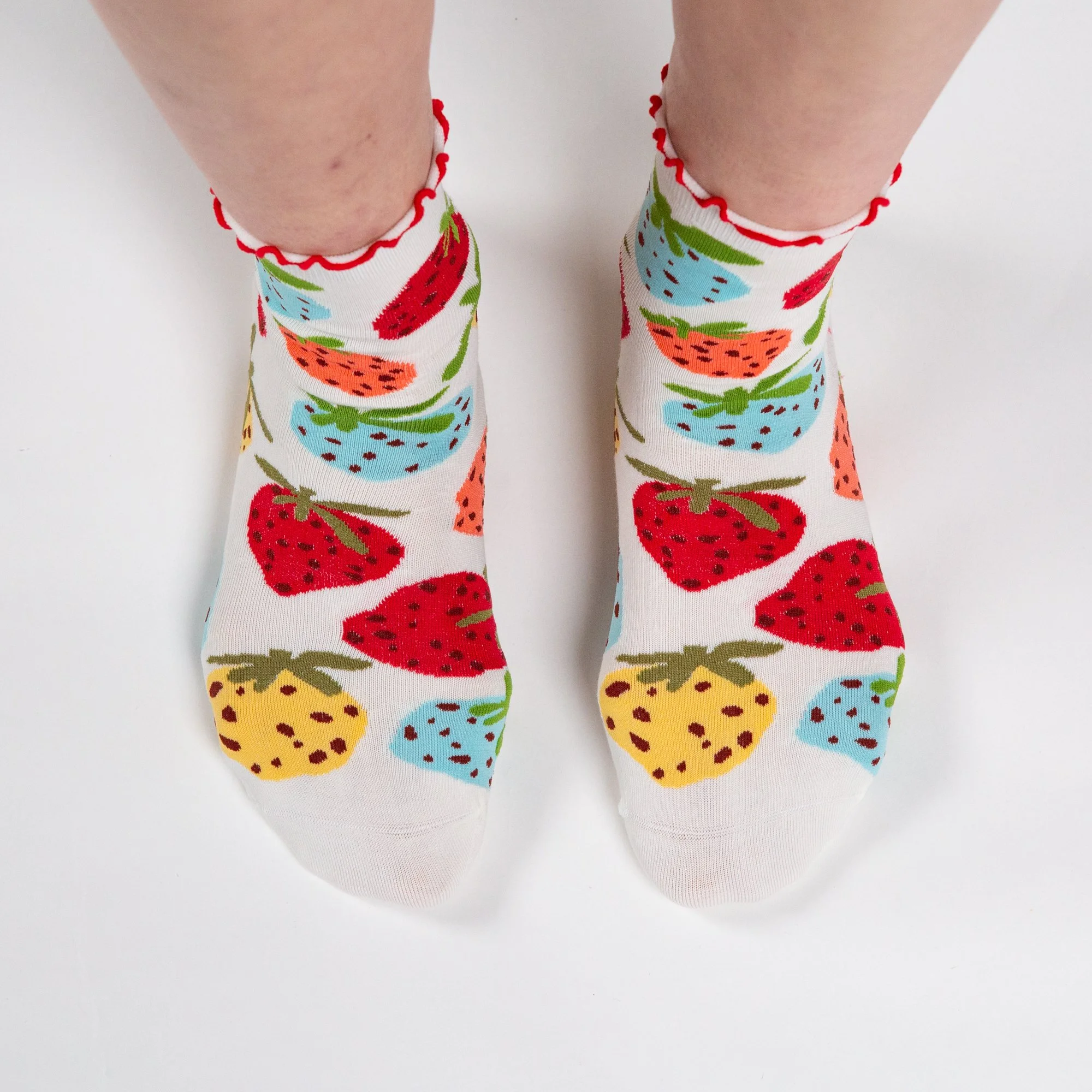 Soft ankle socks featuring the hand-painted Strawberry Dream print and a playful red frill. Comfortable, colourful and perfect for everyday wear.