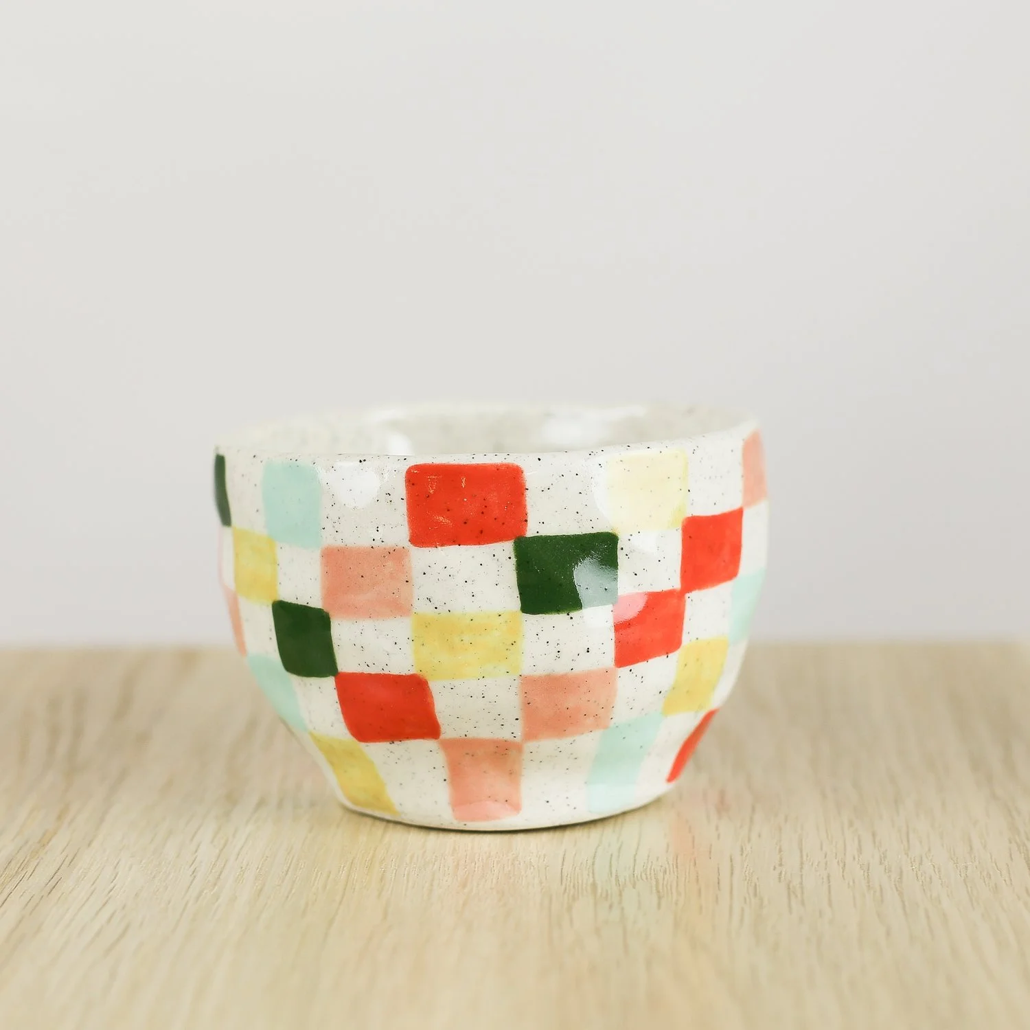 Handmade ceramic cup with colourful check pattern in red pink yellow and blue, 150ml coffee cup by Hello Mae